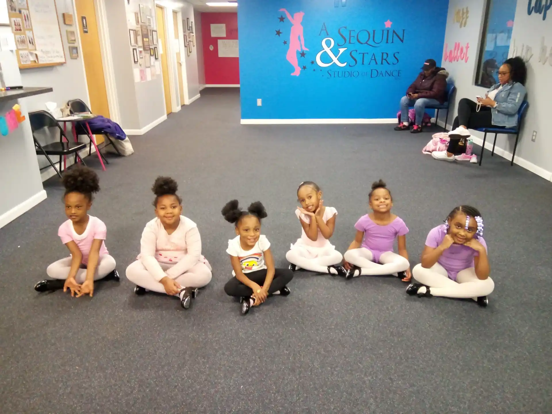 a group of children sitting on the floor
