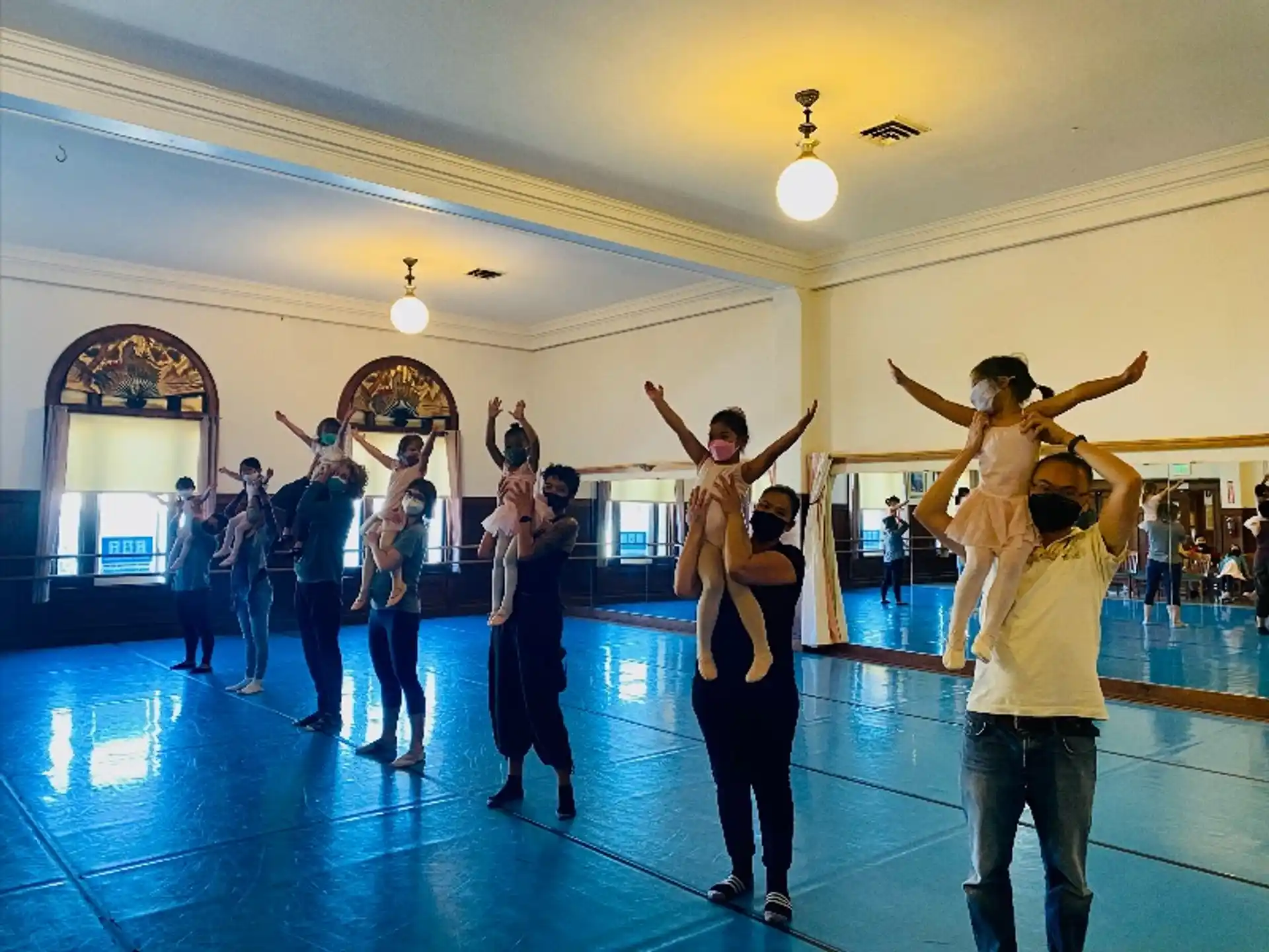 a group of people dancing in a room