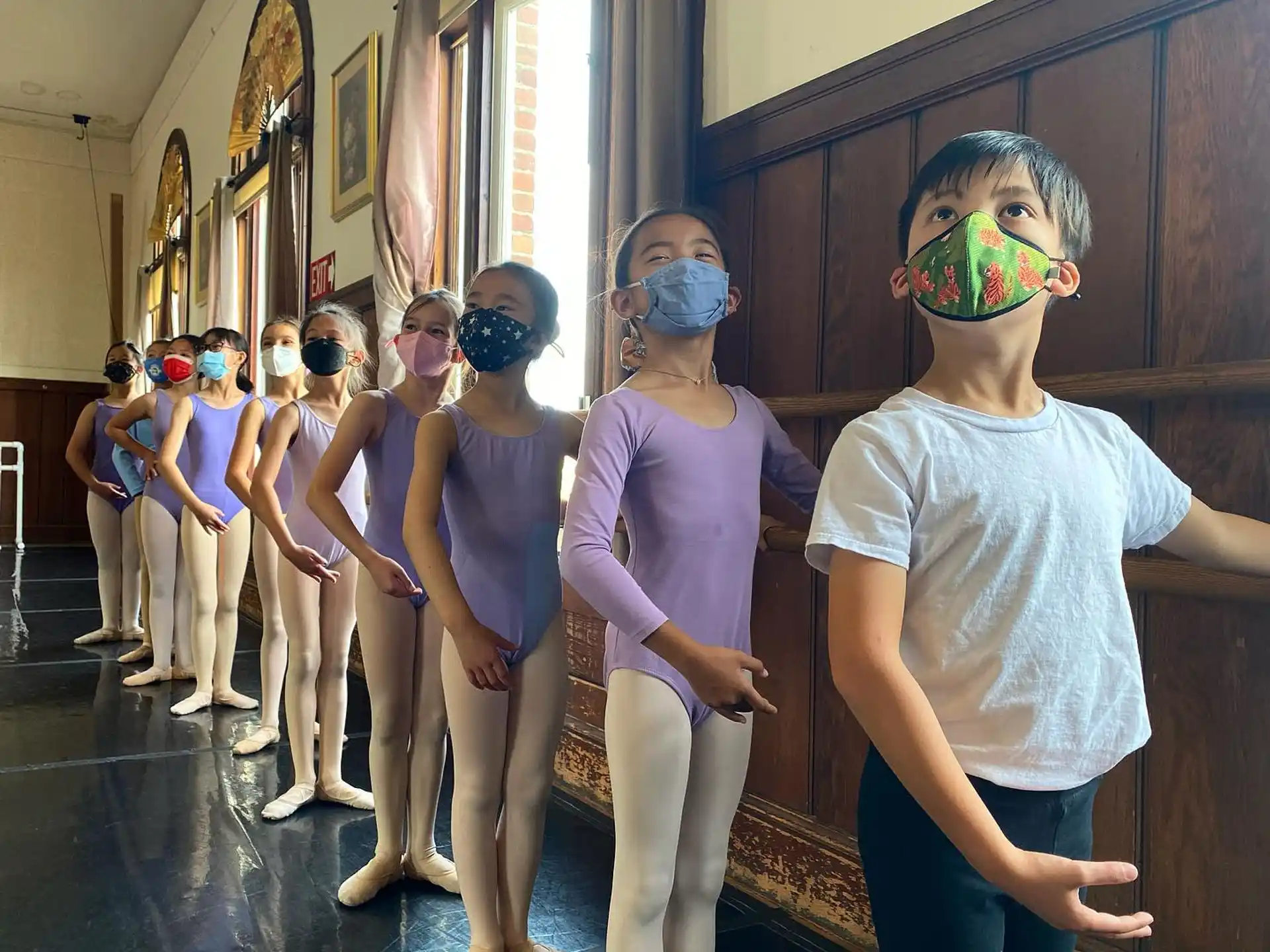 a group of people wearing masks