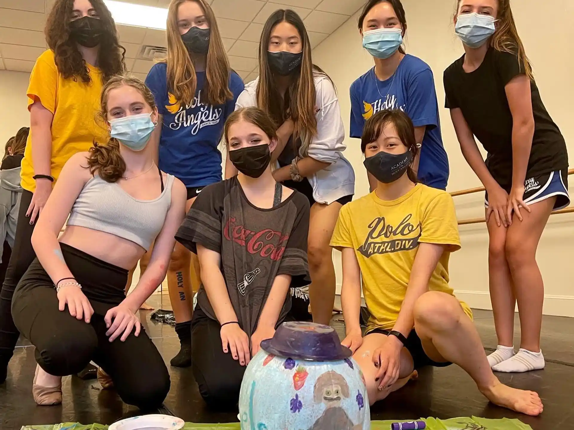 a group of people wearing masks