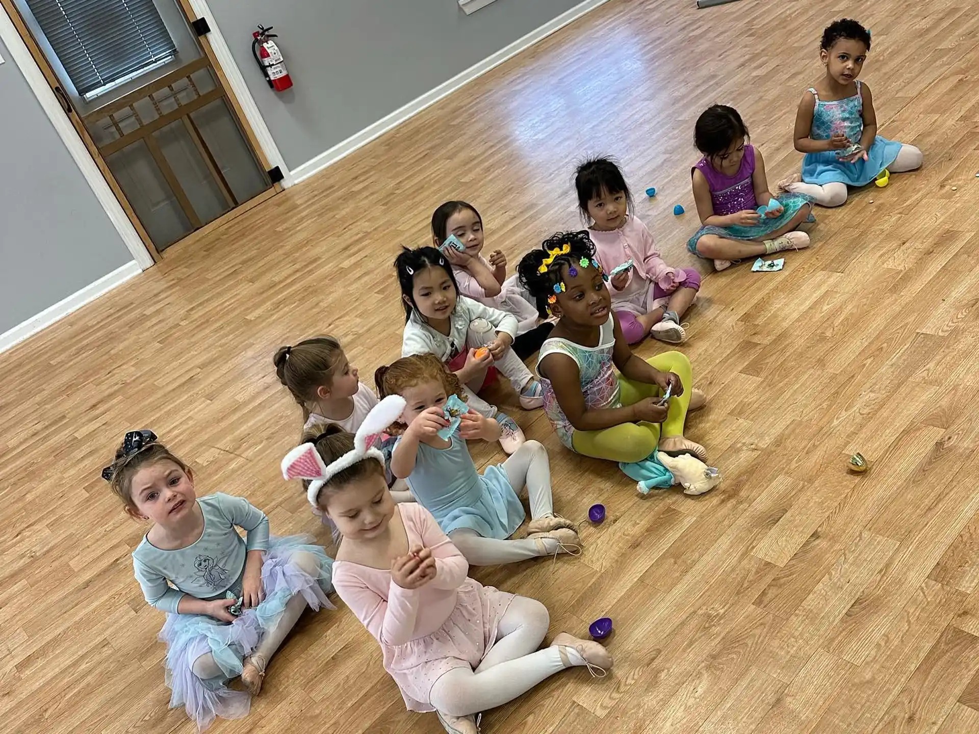 a group of children sitting on the floor