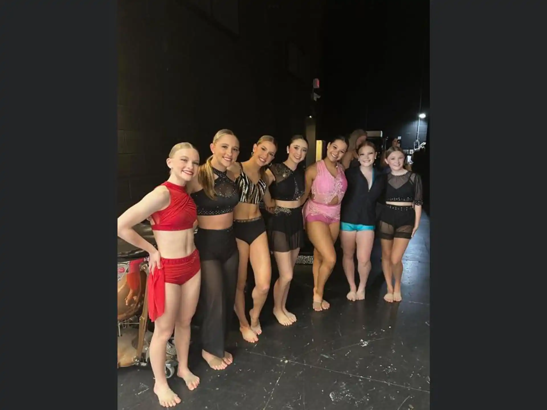 a group of women posing for a photo