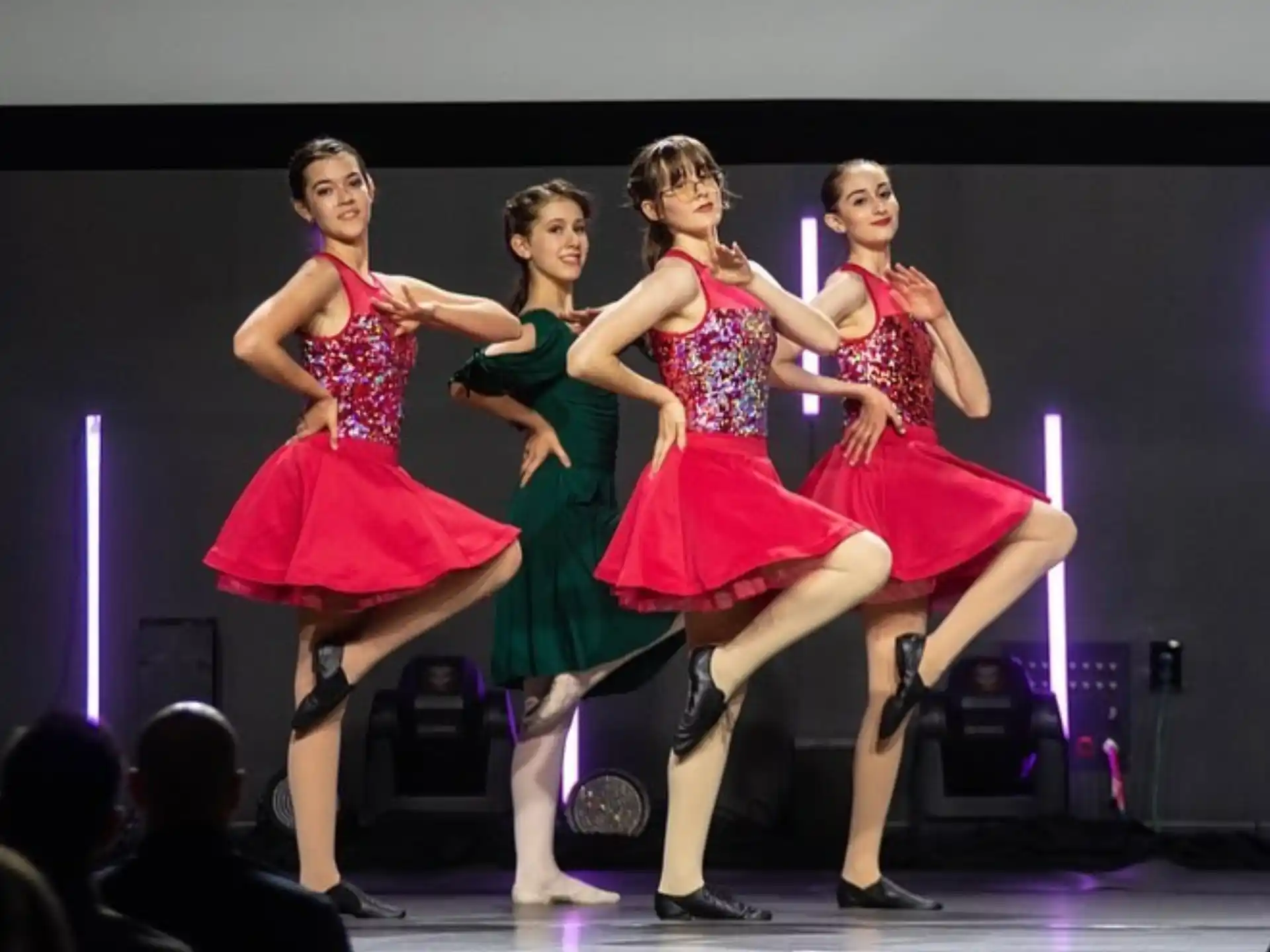 a group of women dancing on a stage