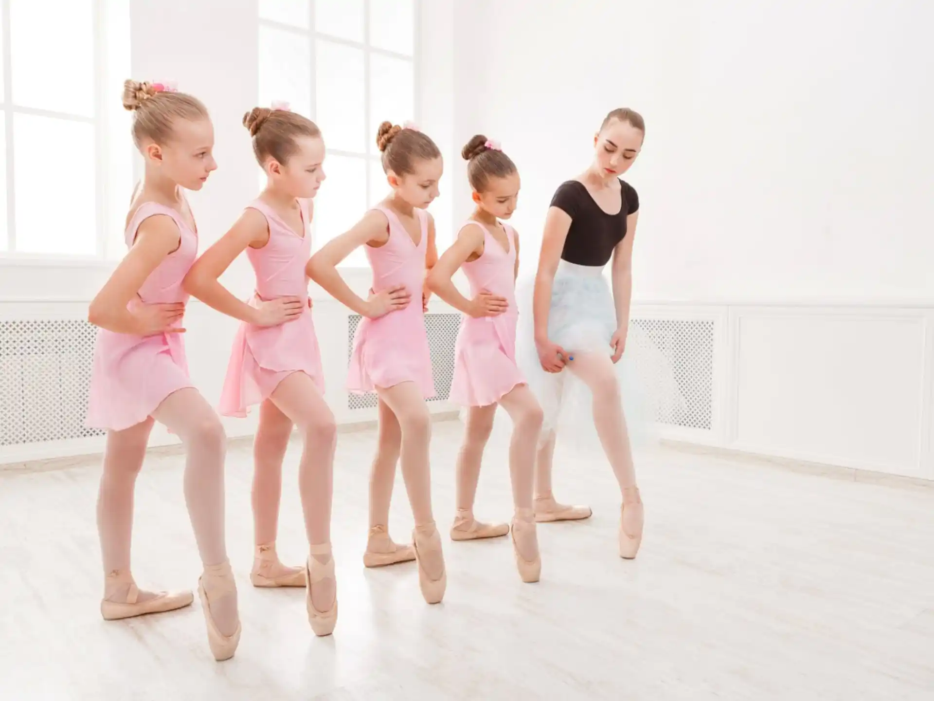 a group of girls in dresses