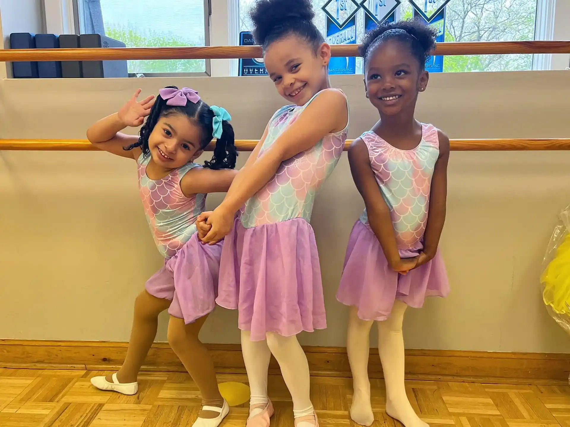 a group of girls in dresses