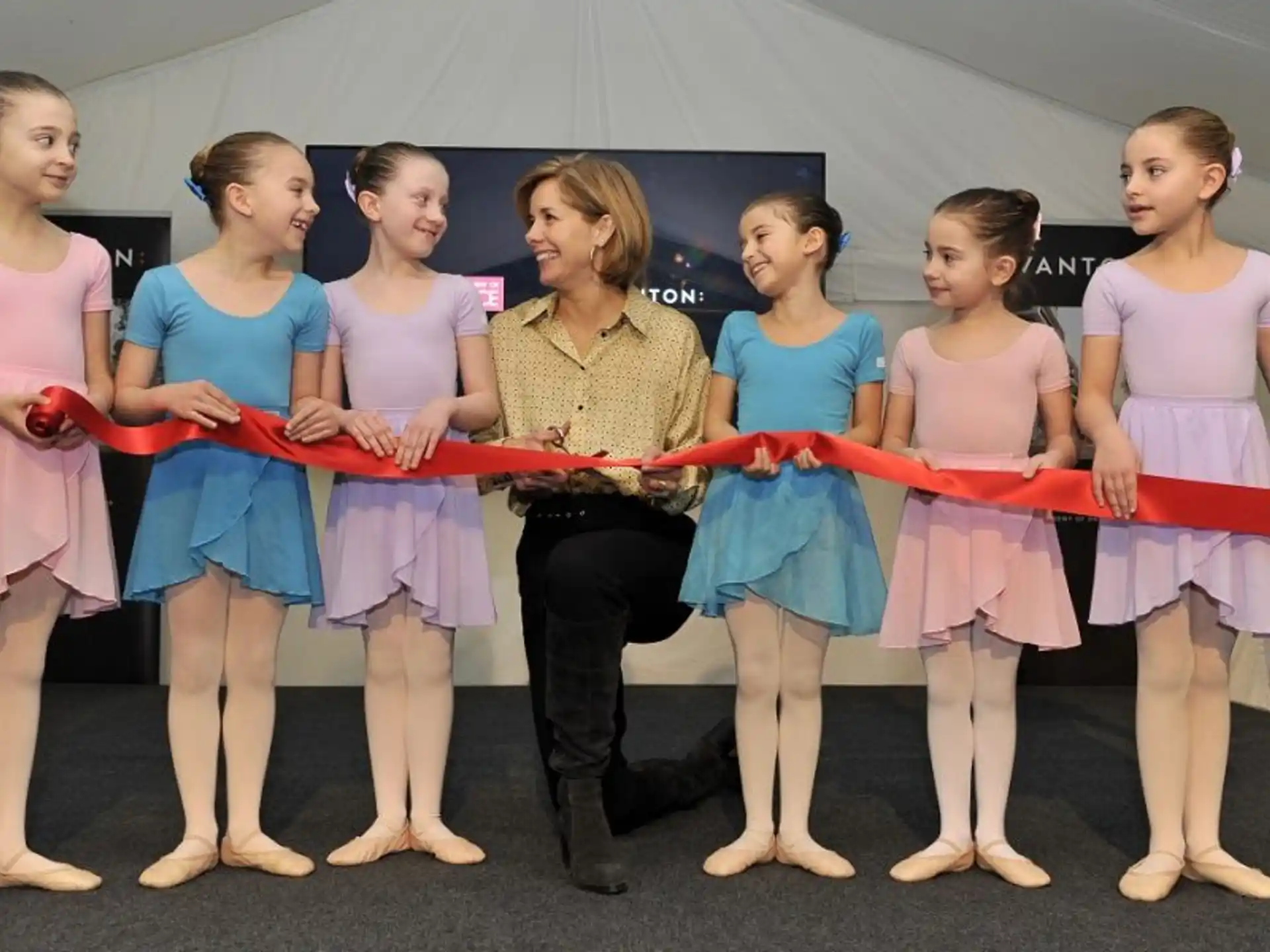 a group of women in matching outfits