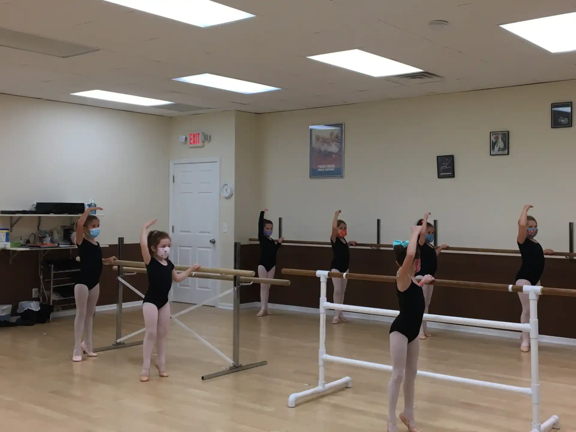 a group of people exercising in a gym