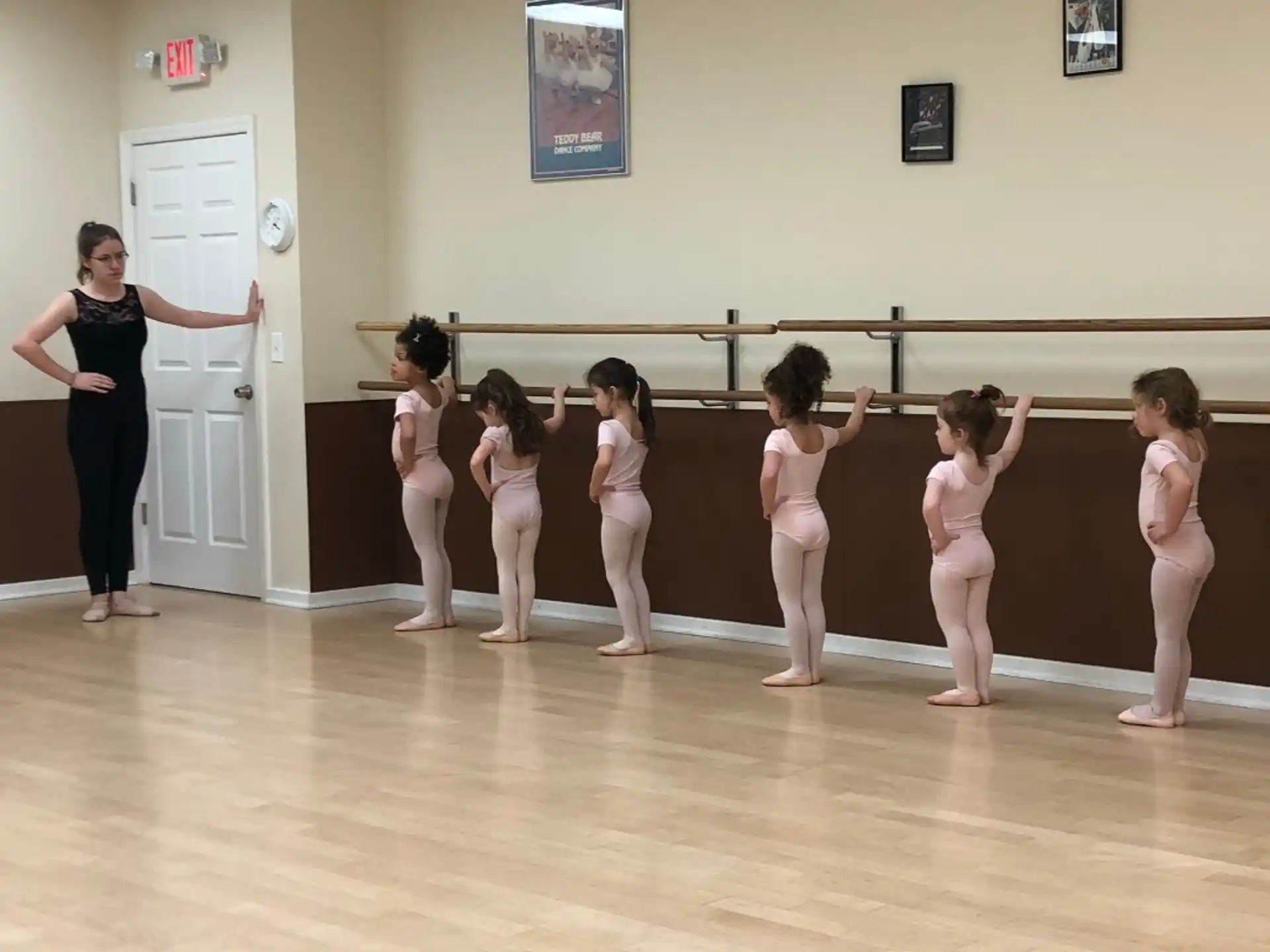a person and a group of children in a room