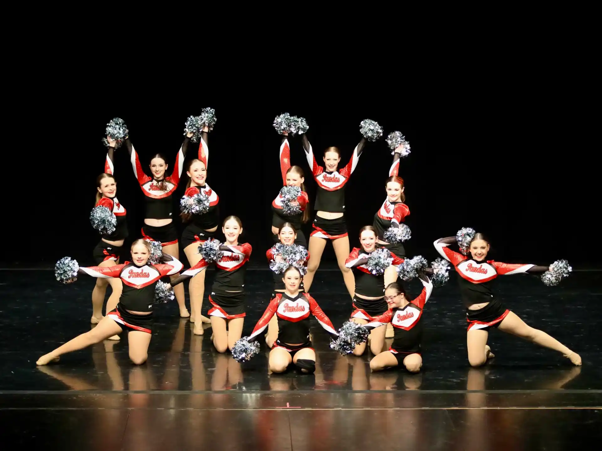 a group of women dancing on a stage