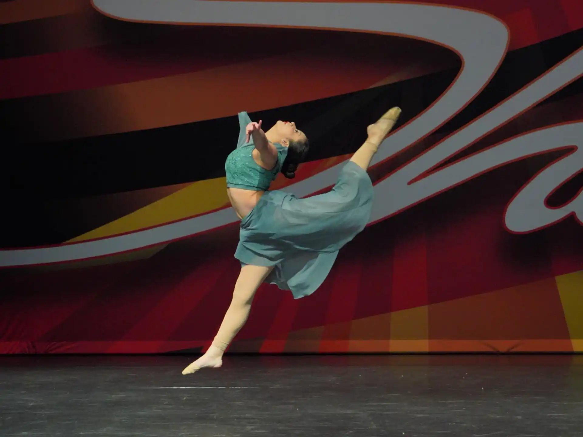 a woman dancing on a stage