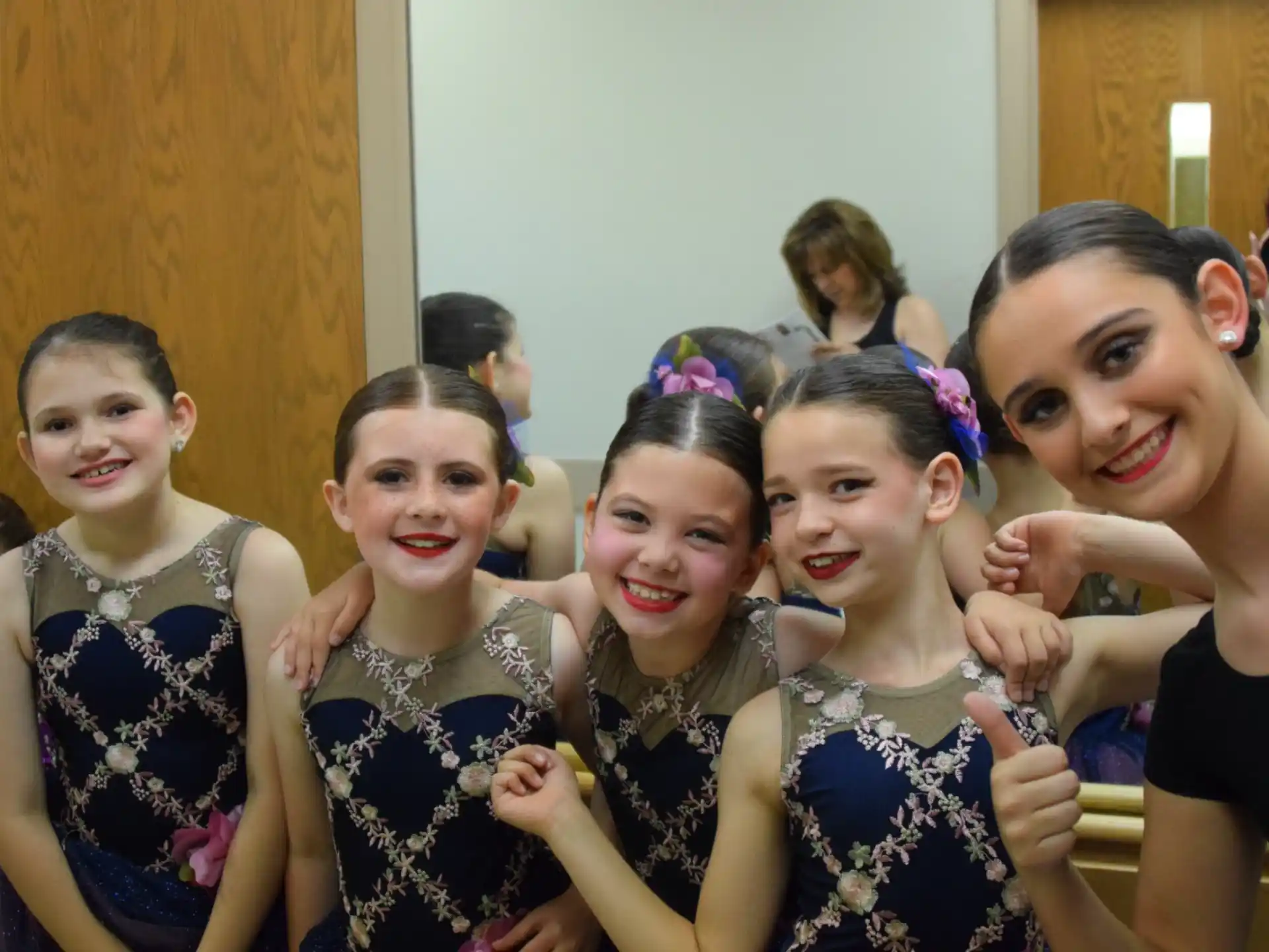 a group of girls posing for a picture