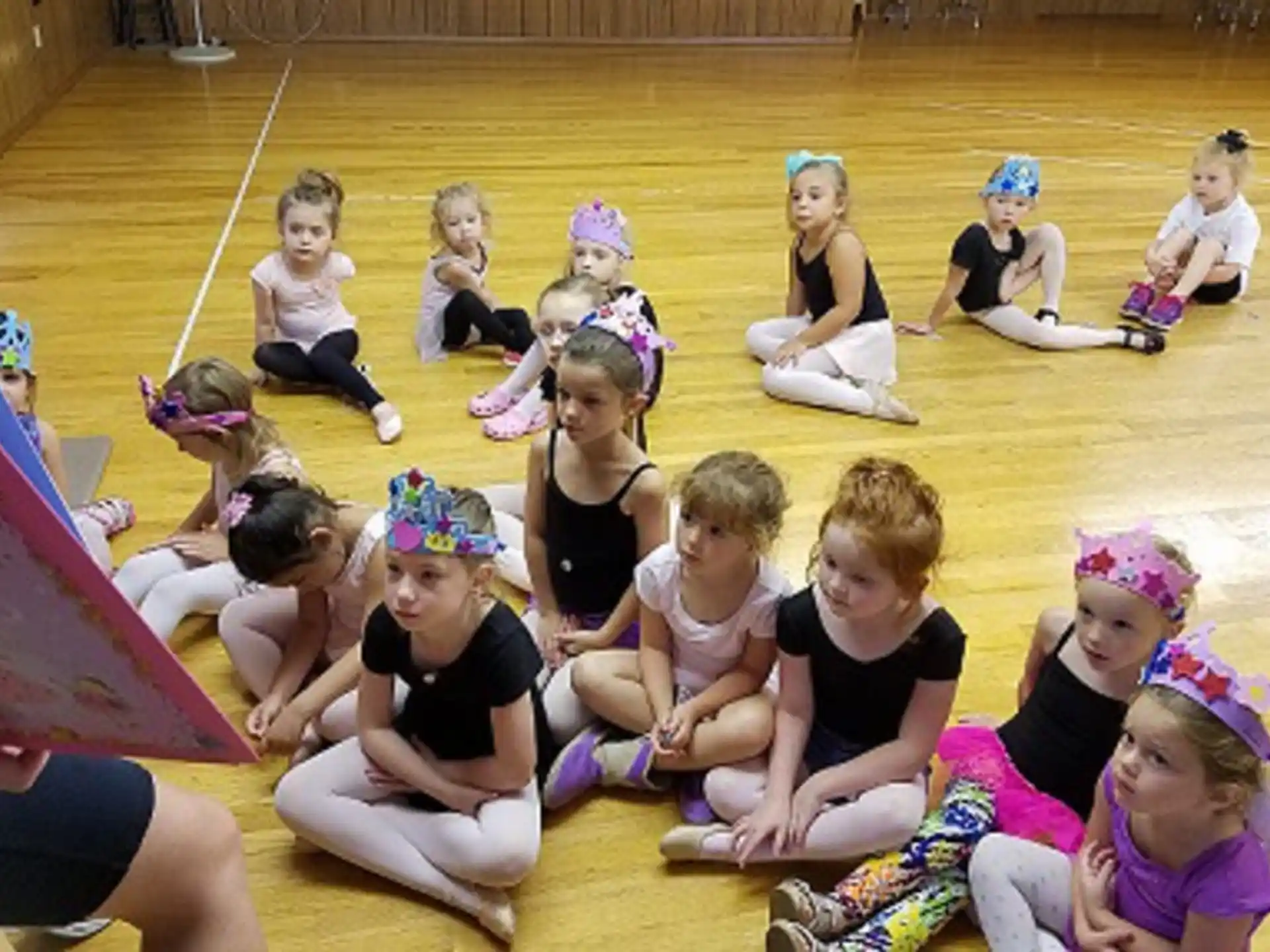 a group of children sitting on the ground