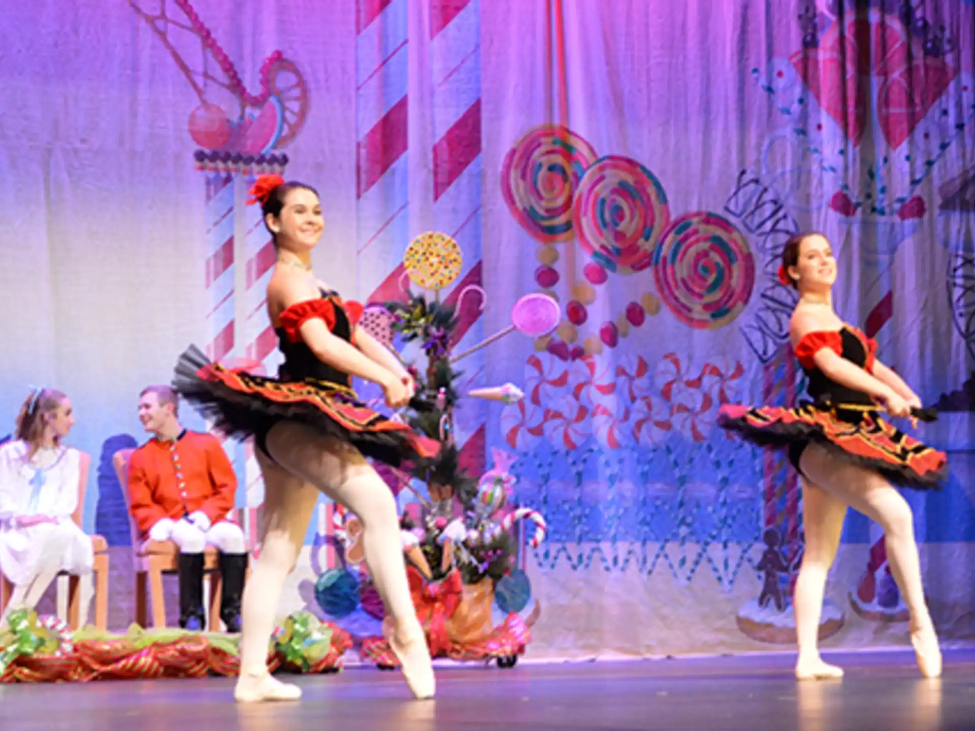a group of women performing on a stage