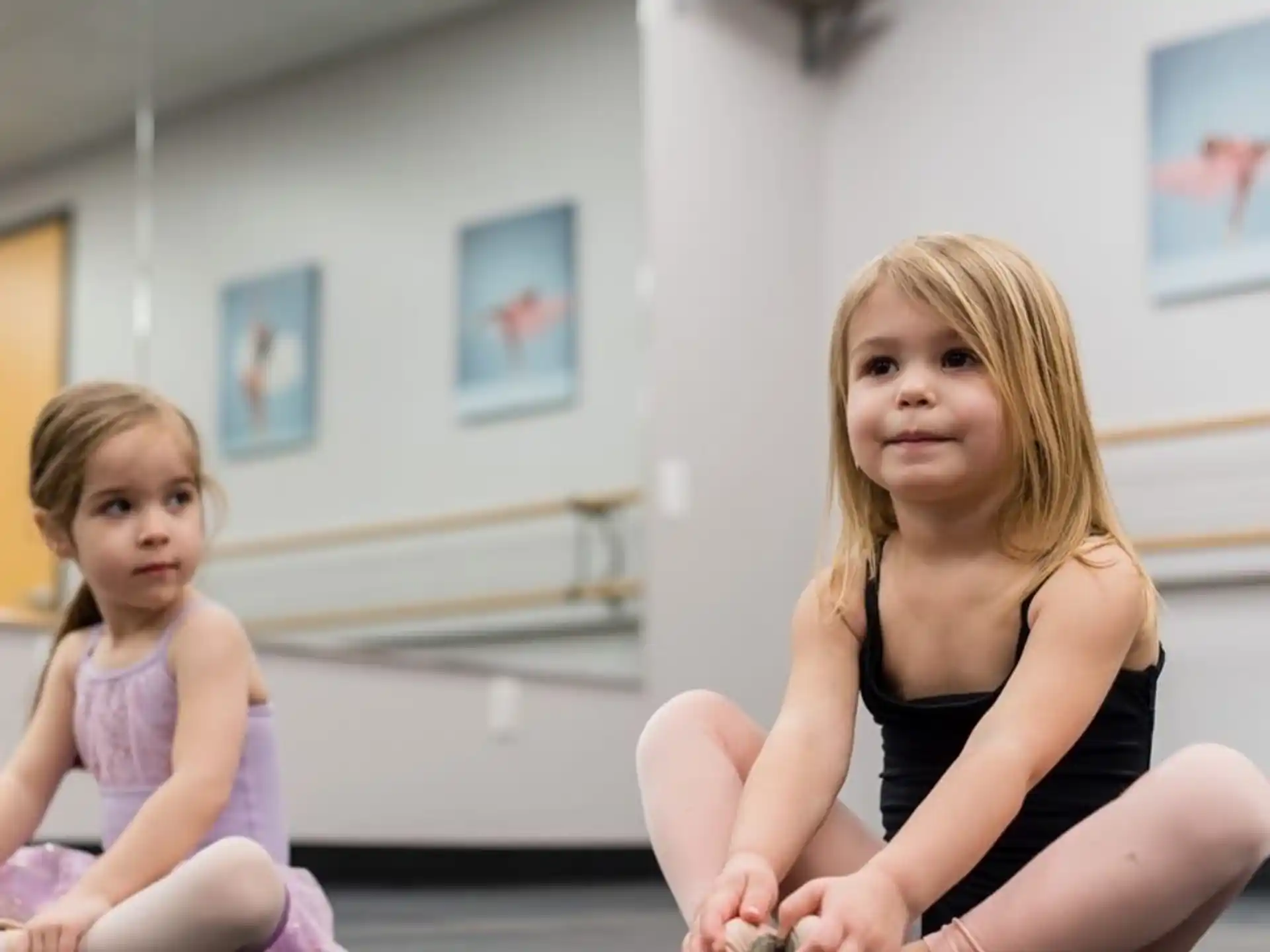 a woman and a child sitting on the floor