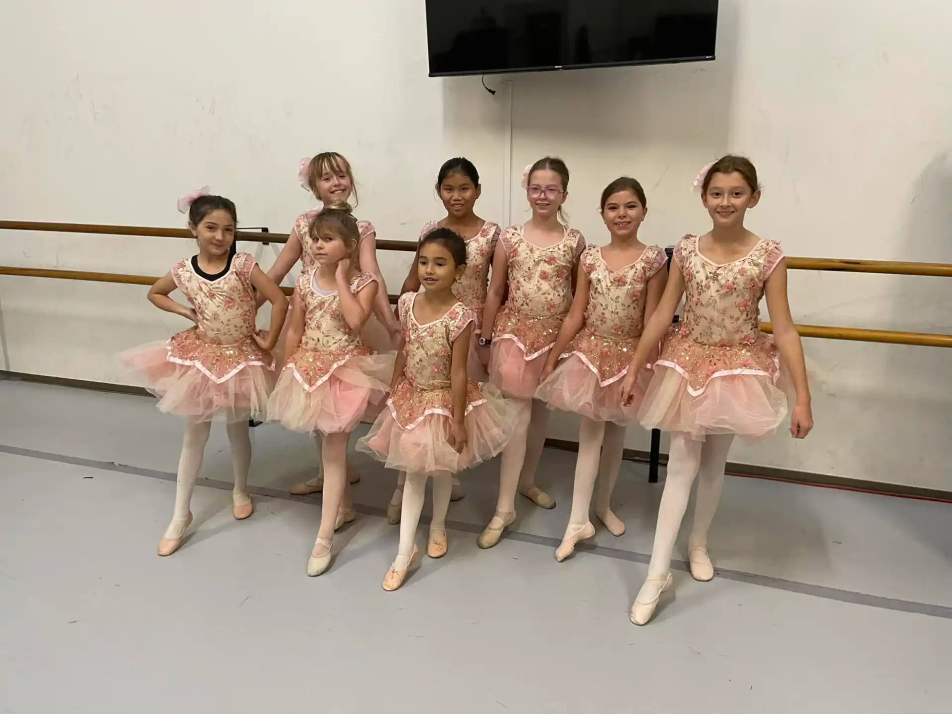 a group of girls in dresses