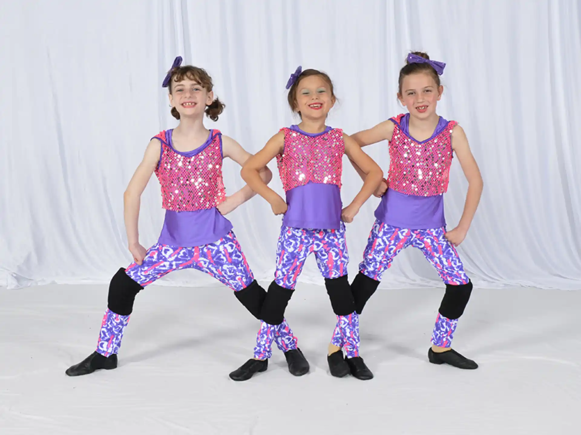 a group of girls wearing colorful clothing