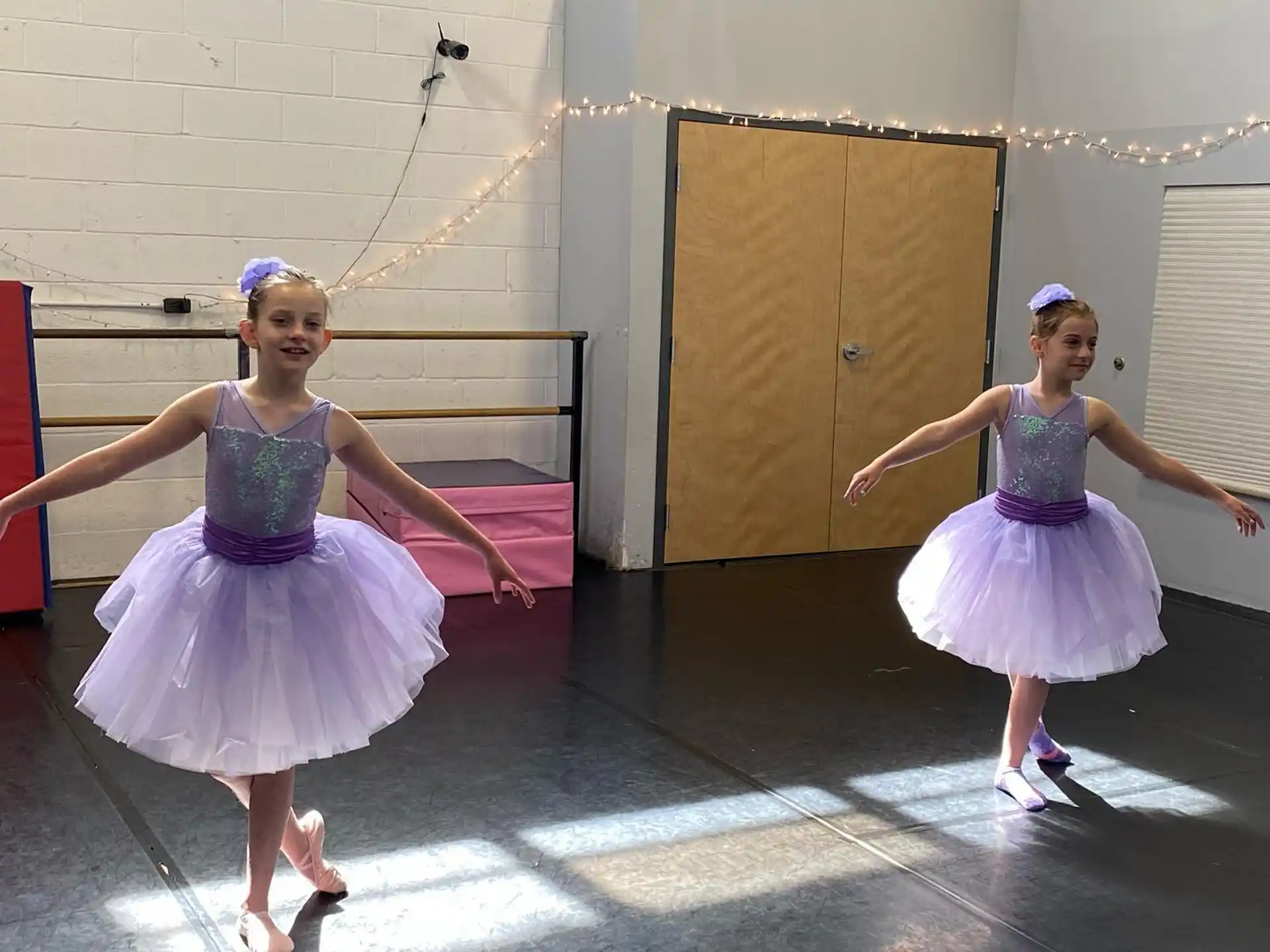 a couple of girls dancing