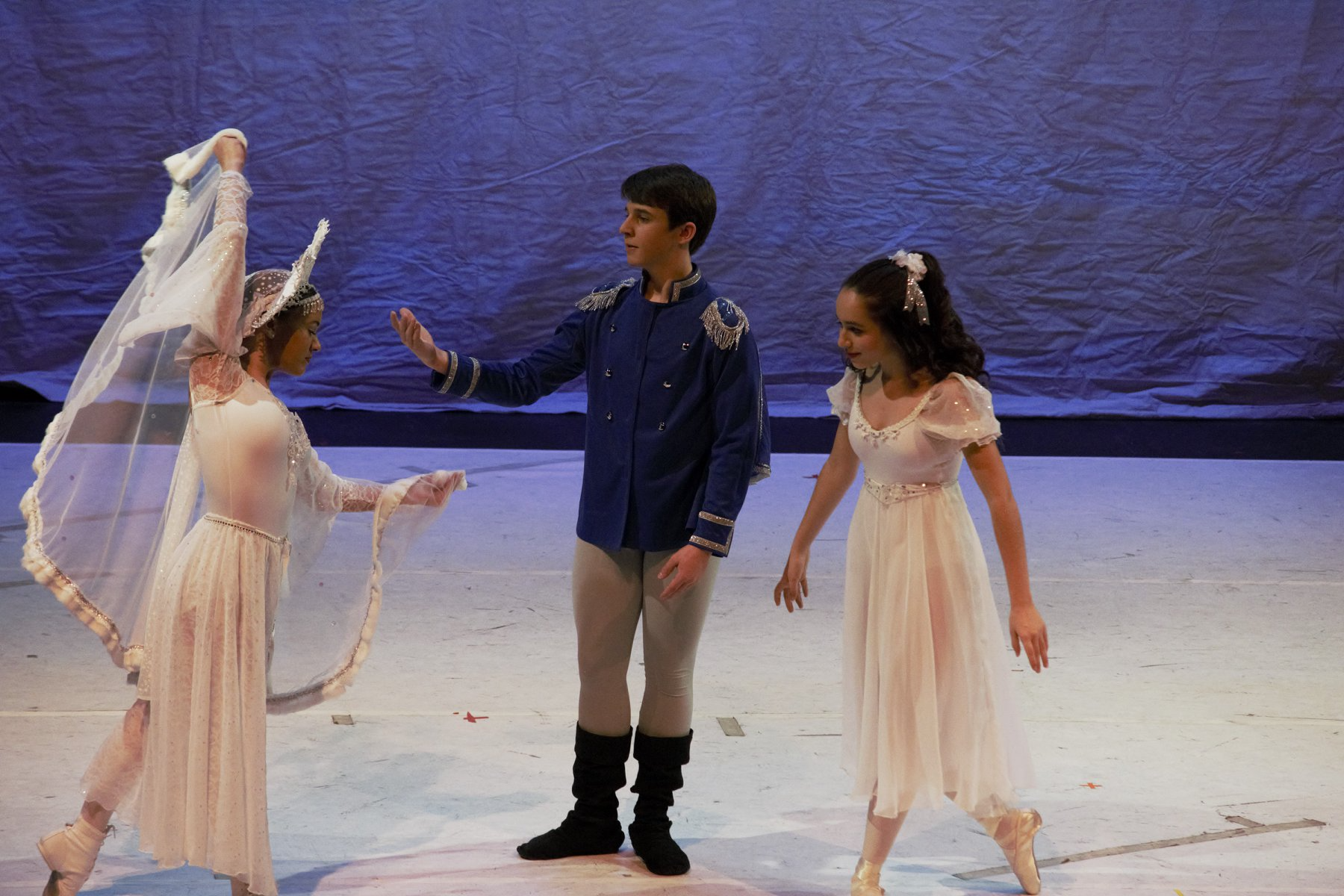 a person and two women dancing