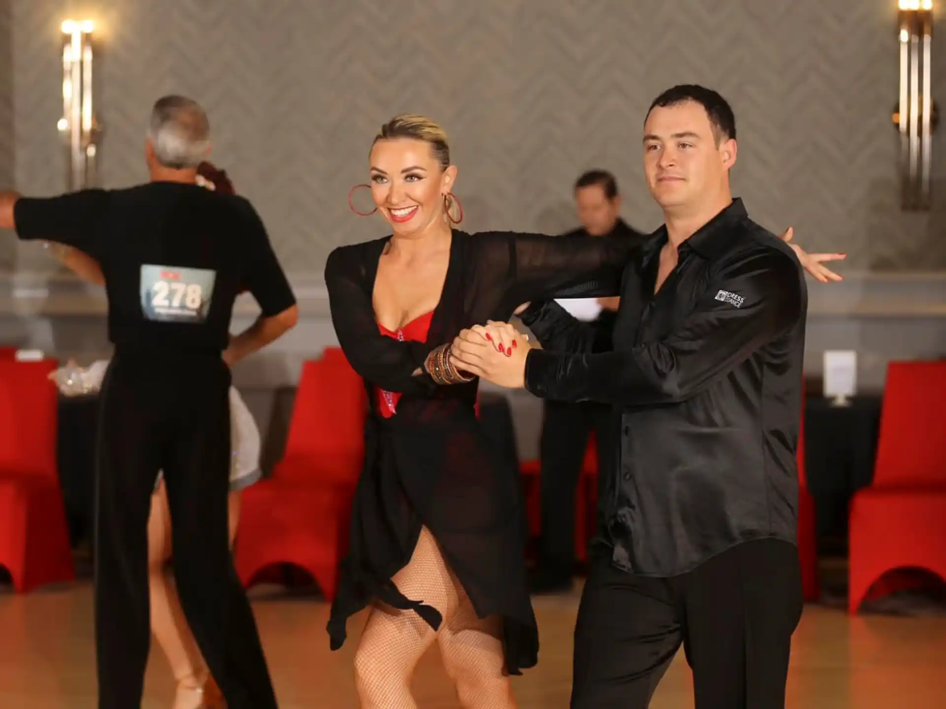 a man and woman dancing