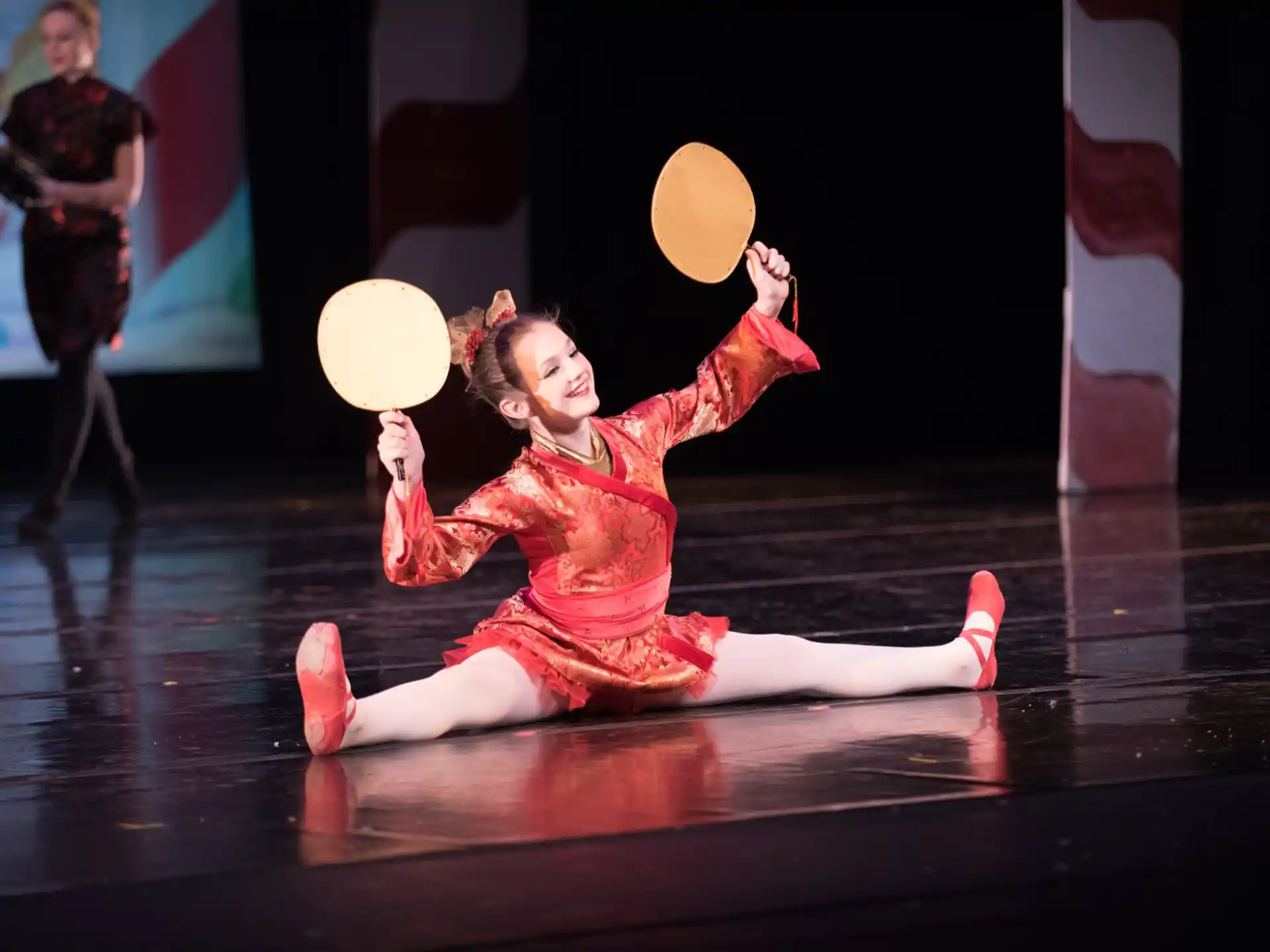 a person in a red dress dancing