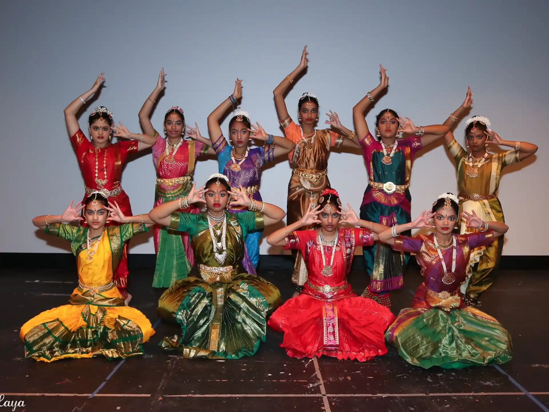 a group of people in colorful dresses