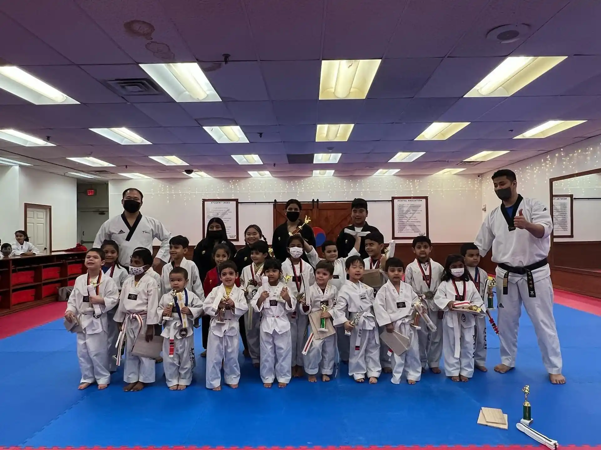 a group of people in karate uniforms