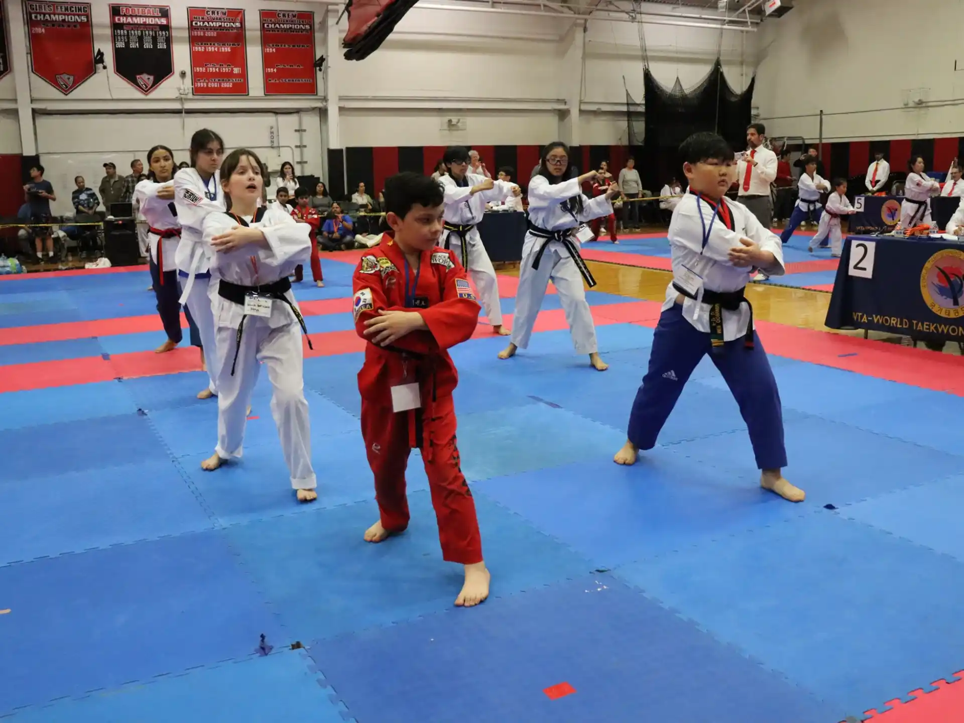 a group of people in karate uniforms