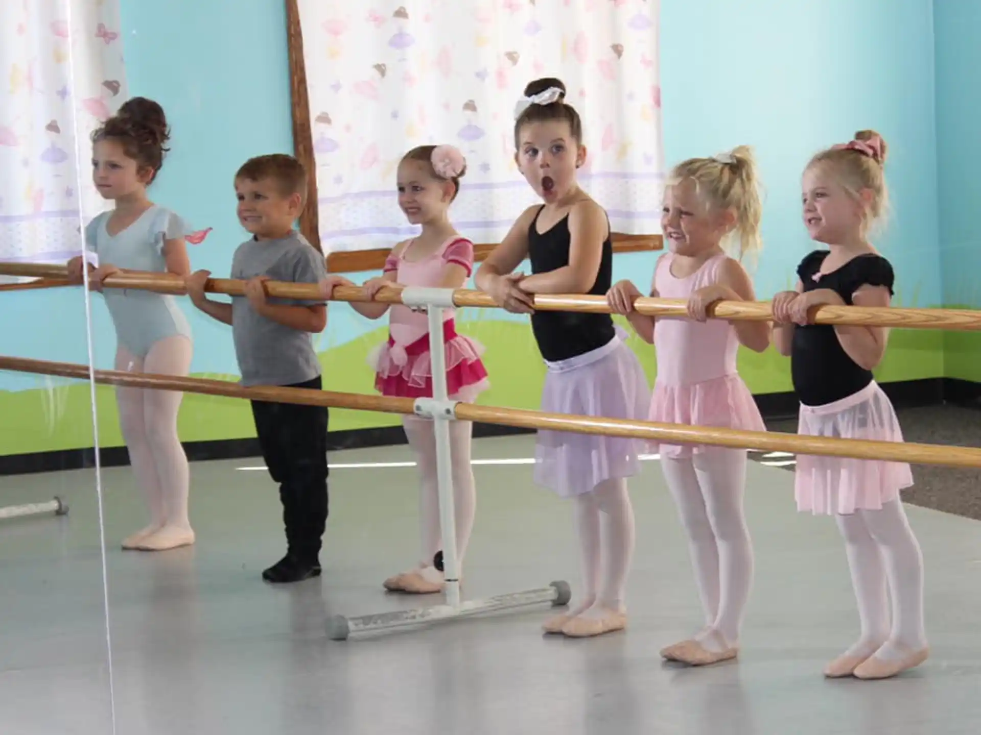 a group of children performing on a stage