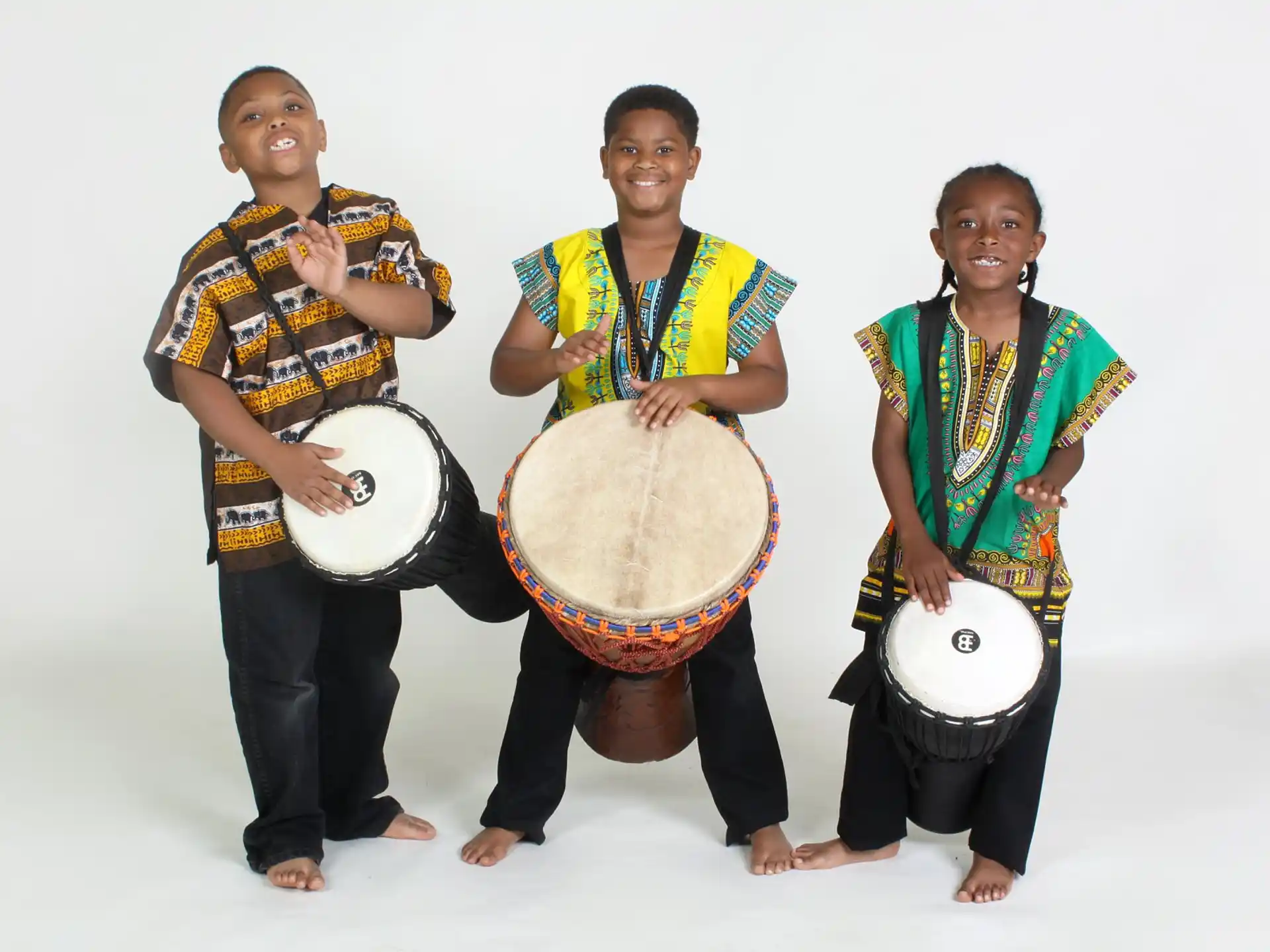a group of people holding drums