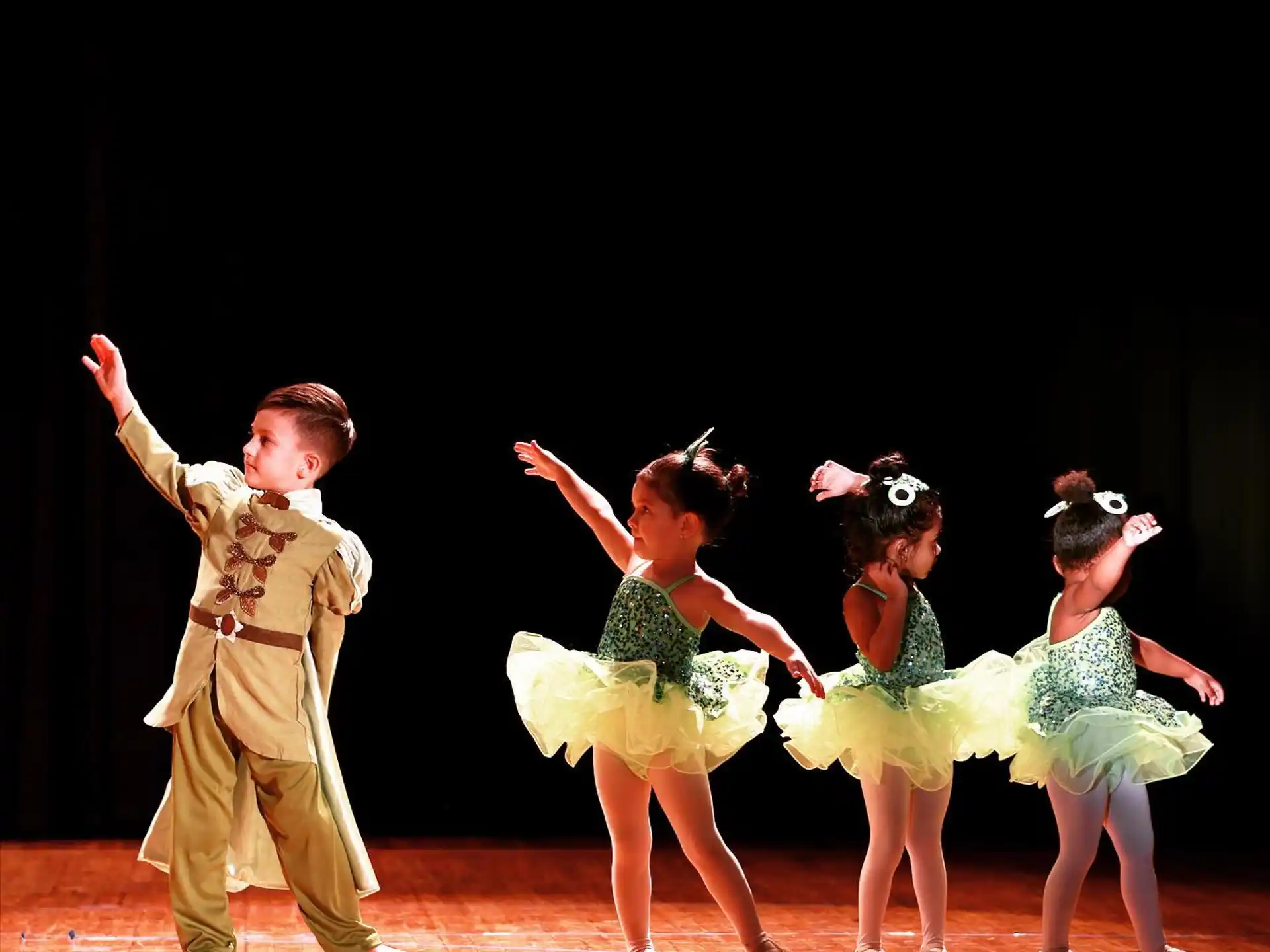 a group of people dancing on a stage