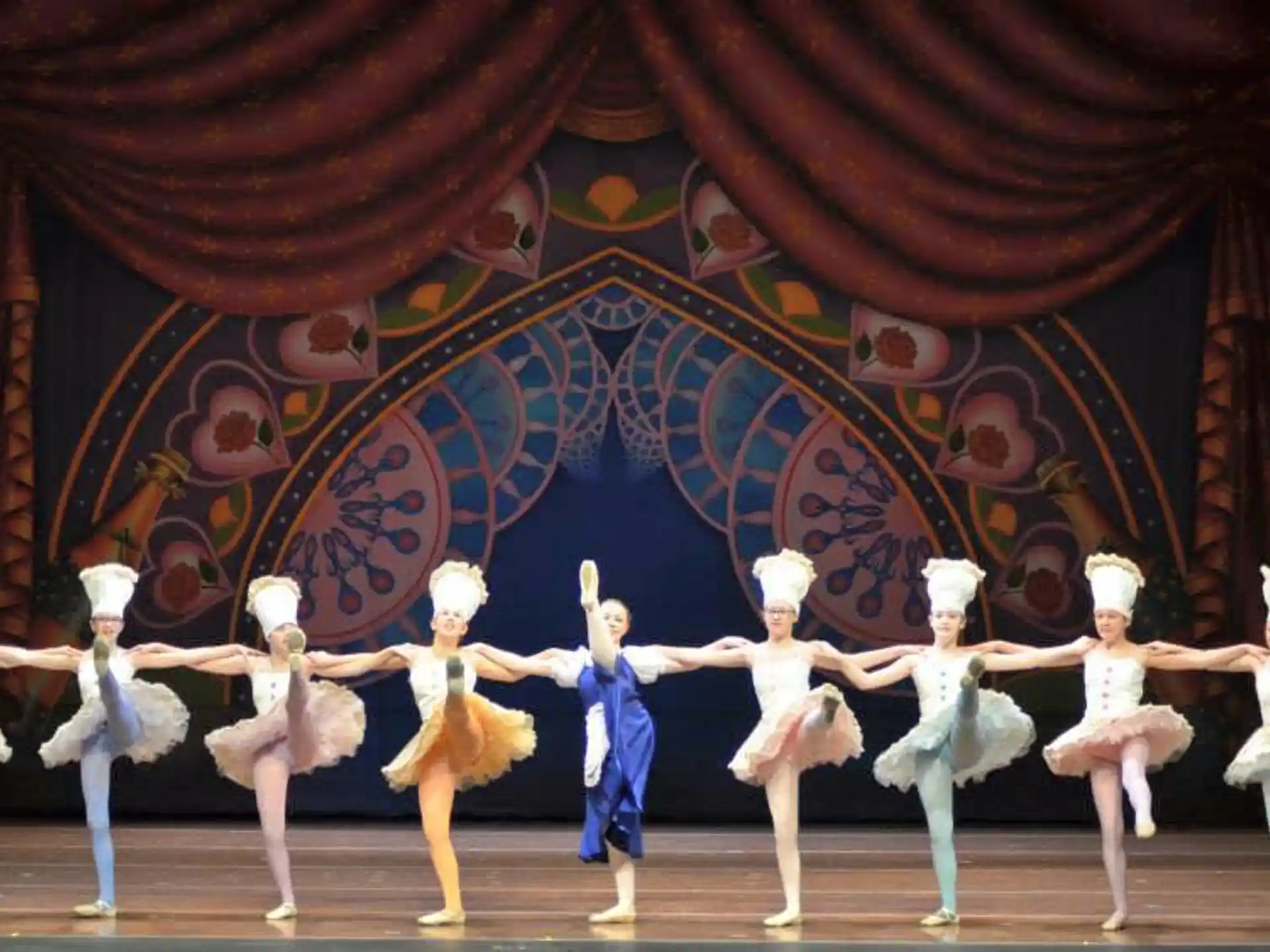 a group of people dancing on a stage