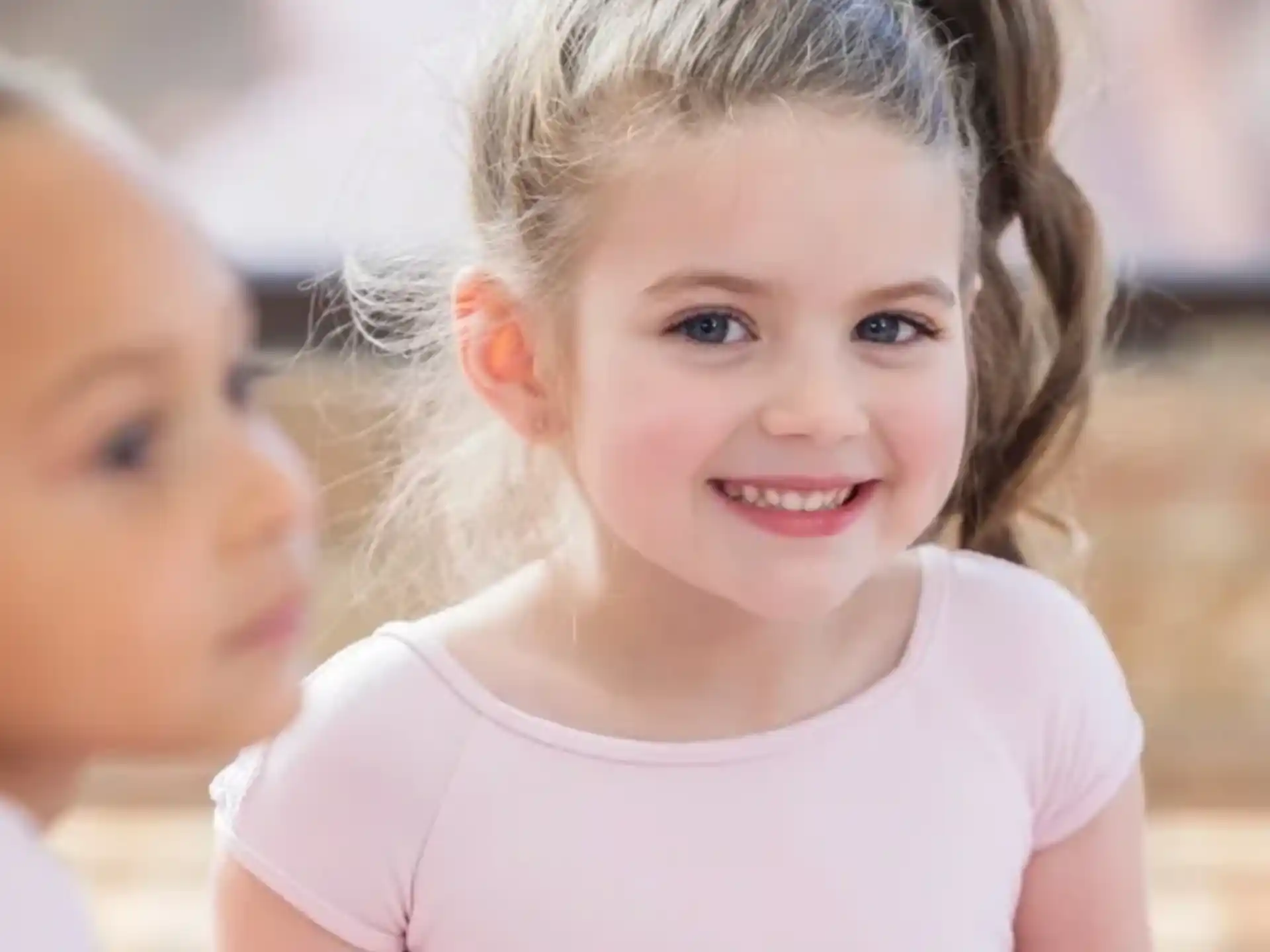 a close-up of a young girl smiling