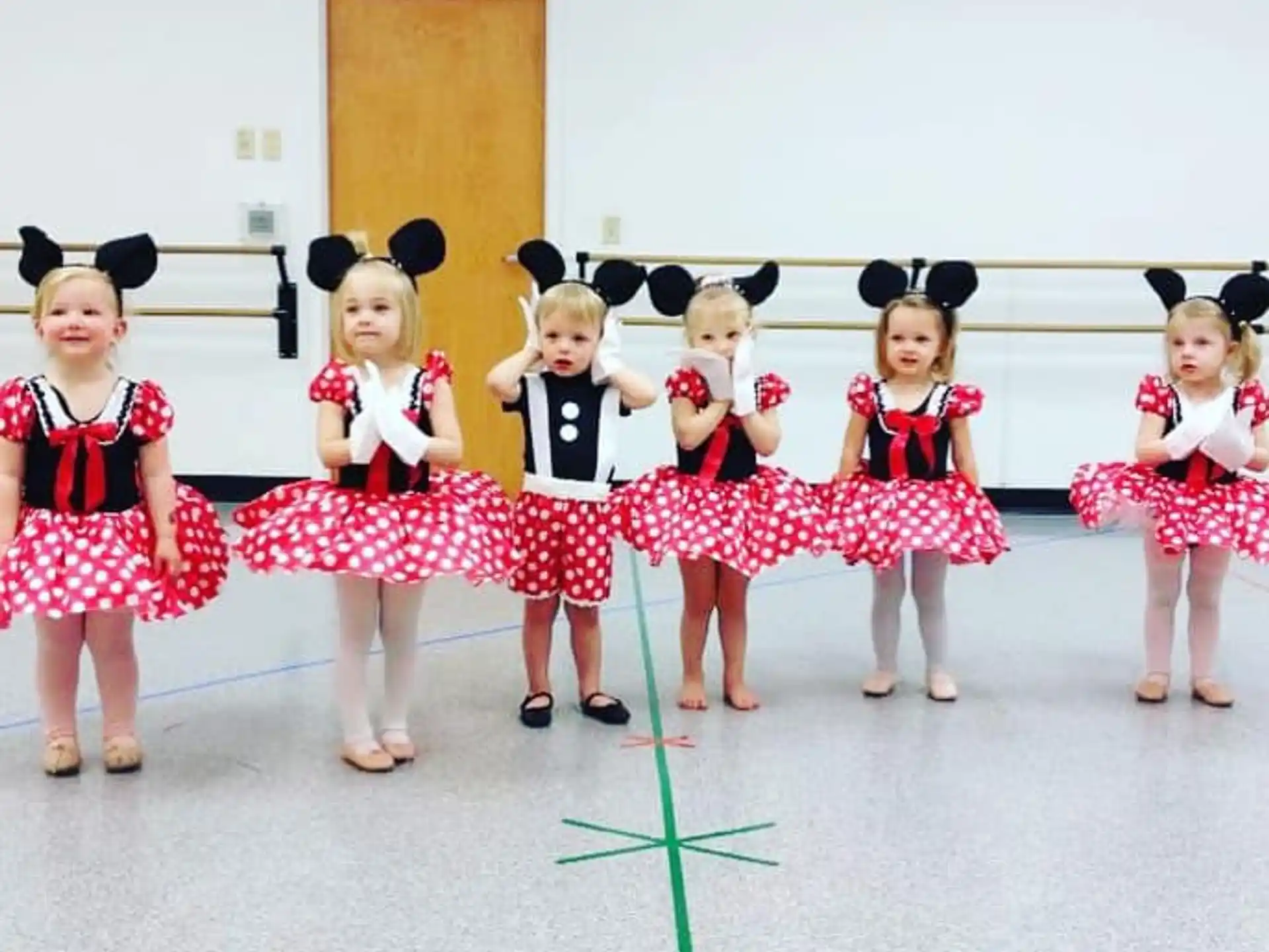 a group of girls in a dance pose