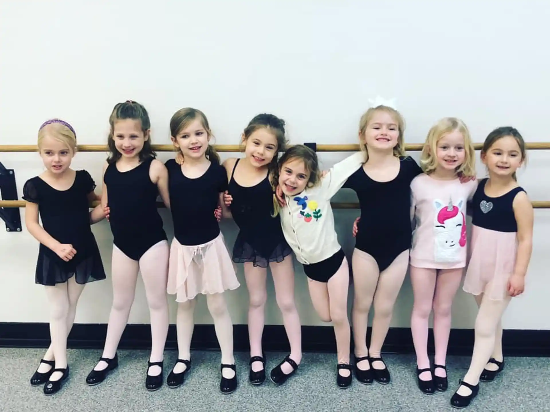a group of girls posing for a photo