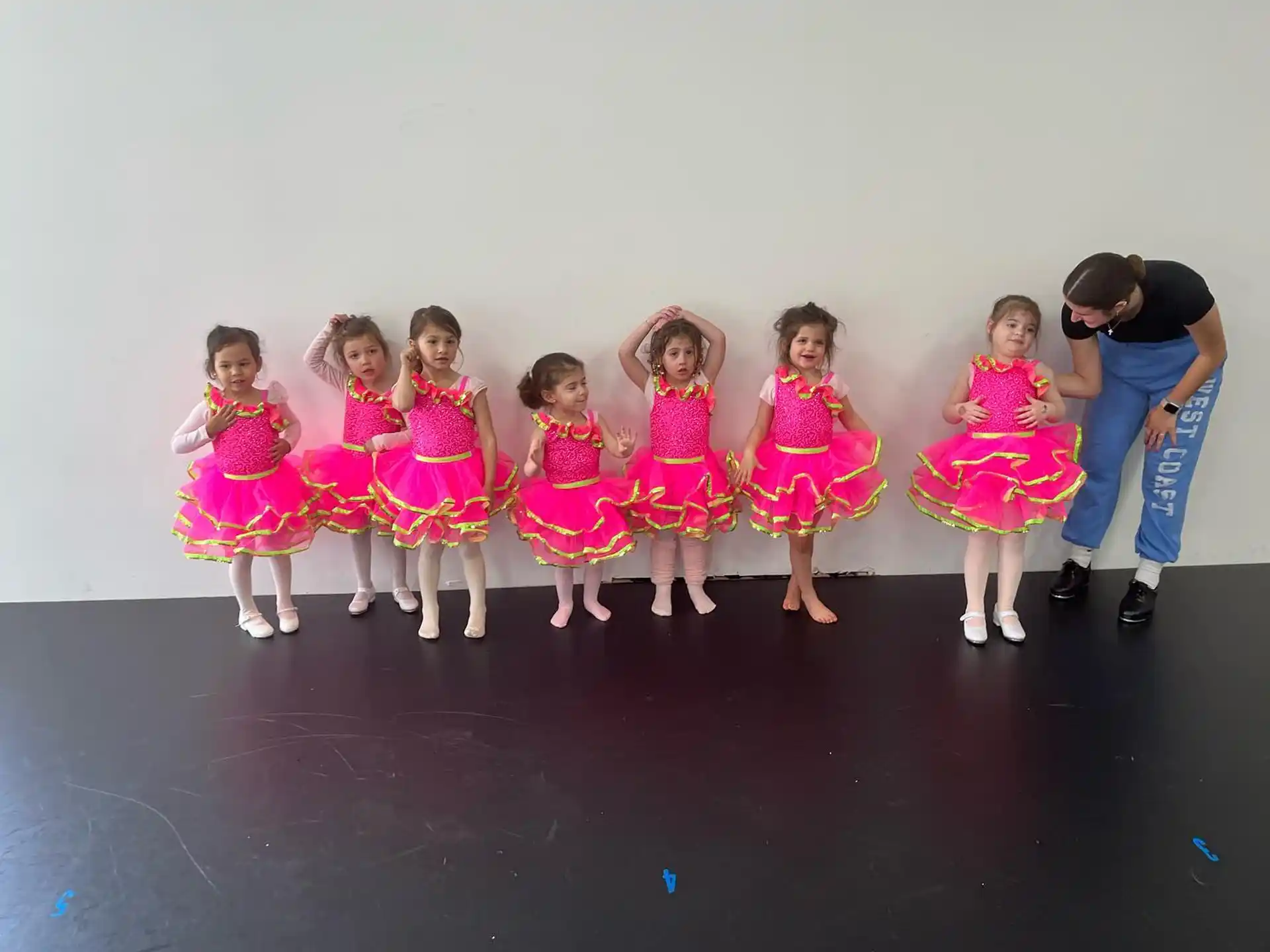 a group of girls in dresses