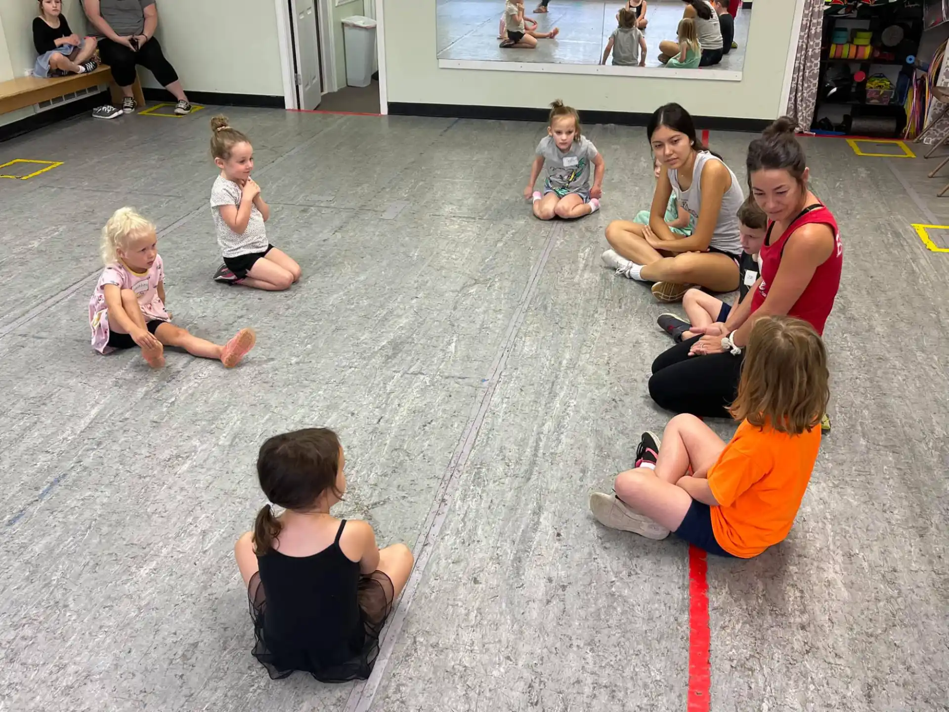a group of people sitting on the floor