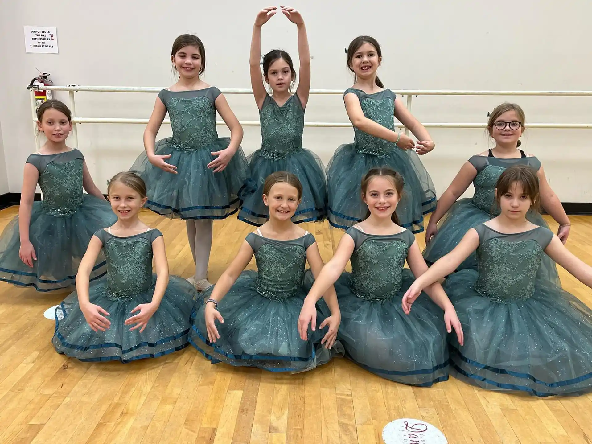 a group of women in dresses