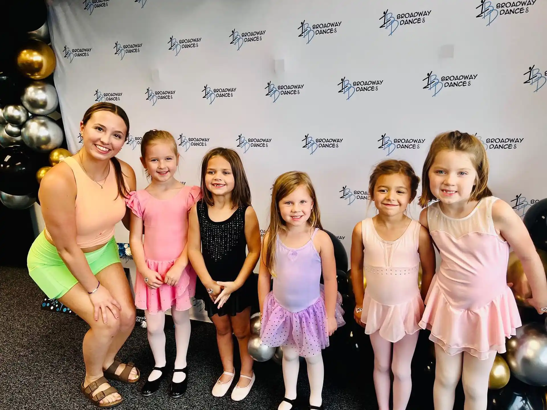 a group of girls posing for a photo