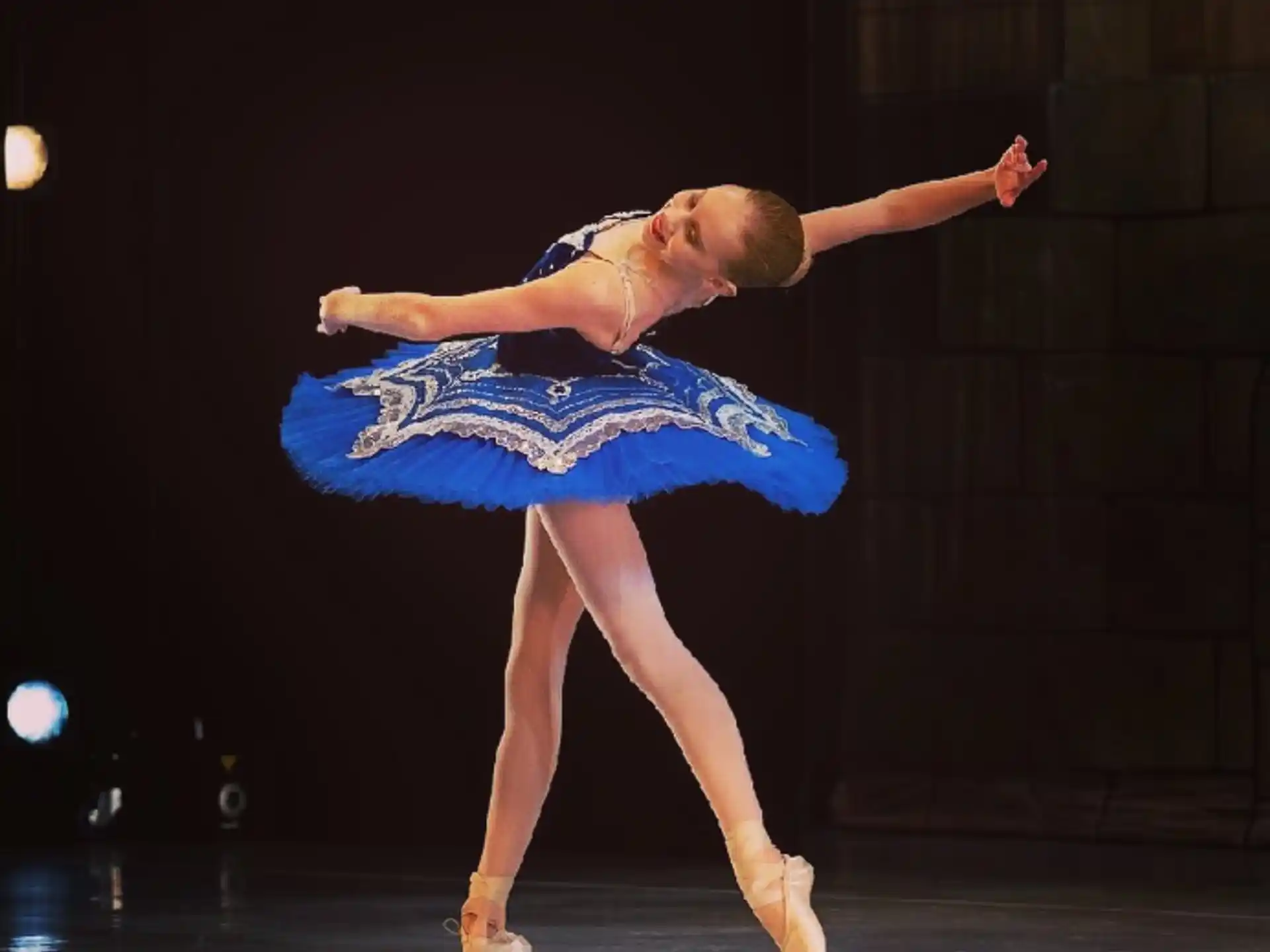 a woman dancing on a stage