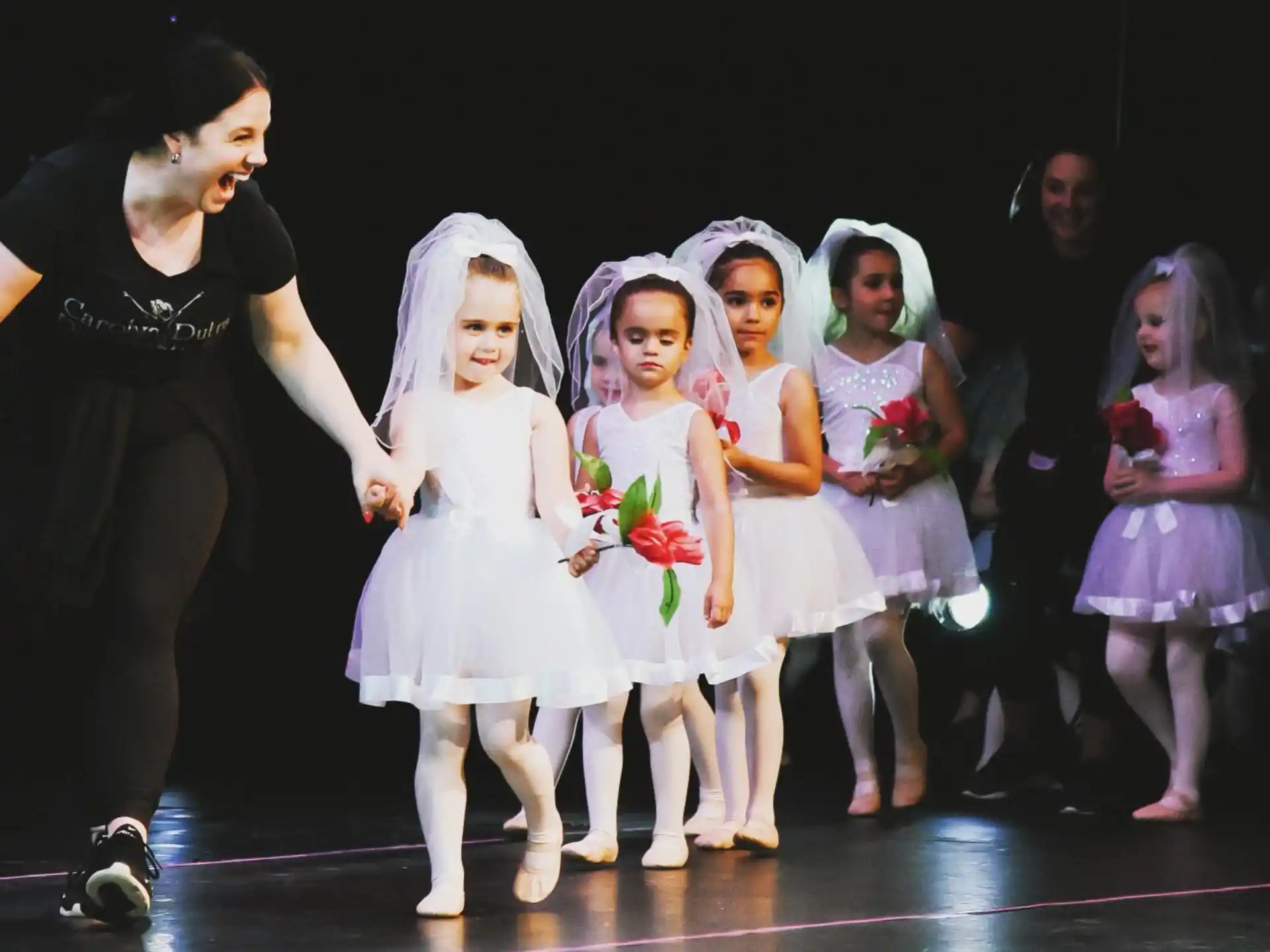a group of girls on a stage