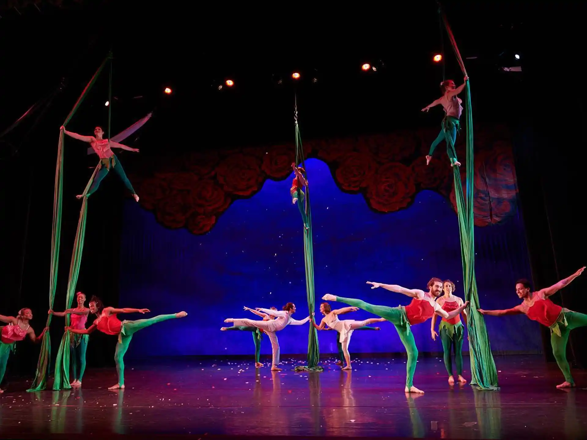 a group of people performing on a stage