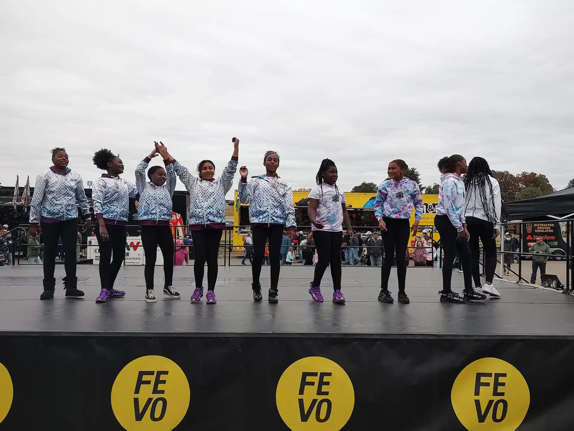 a group of people standing on a stage