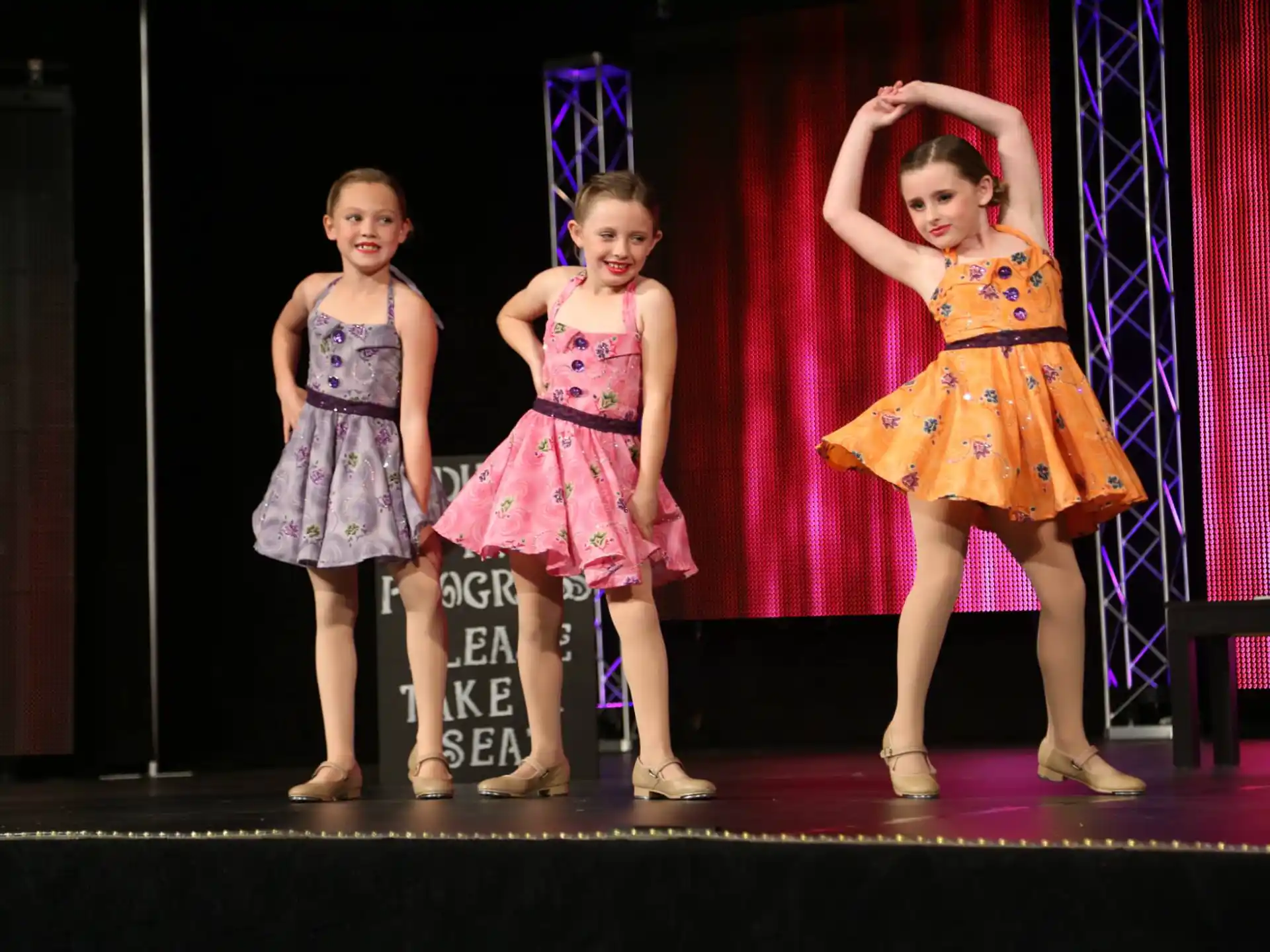 a group of girls on a stage