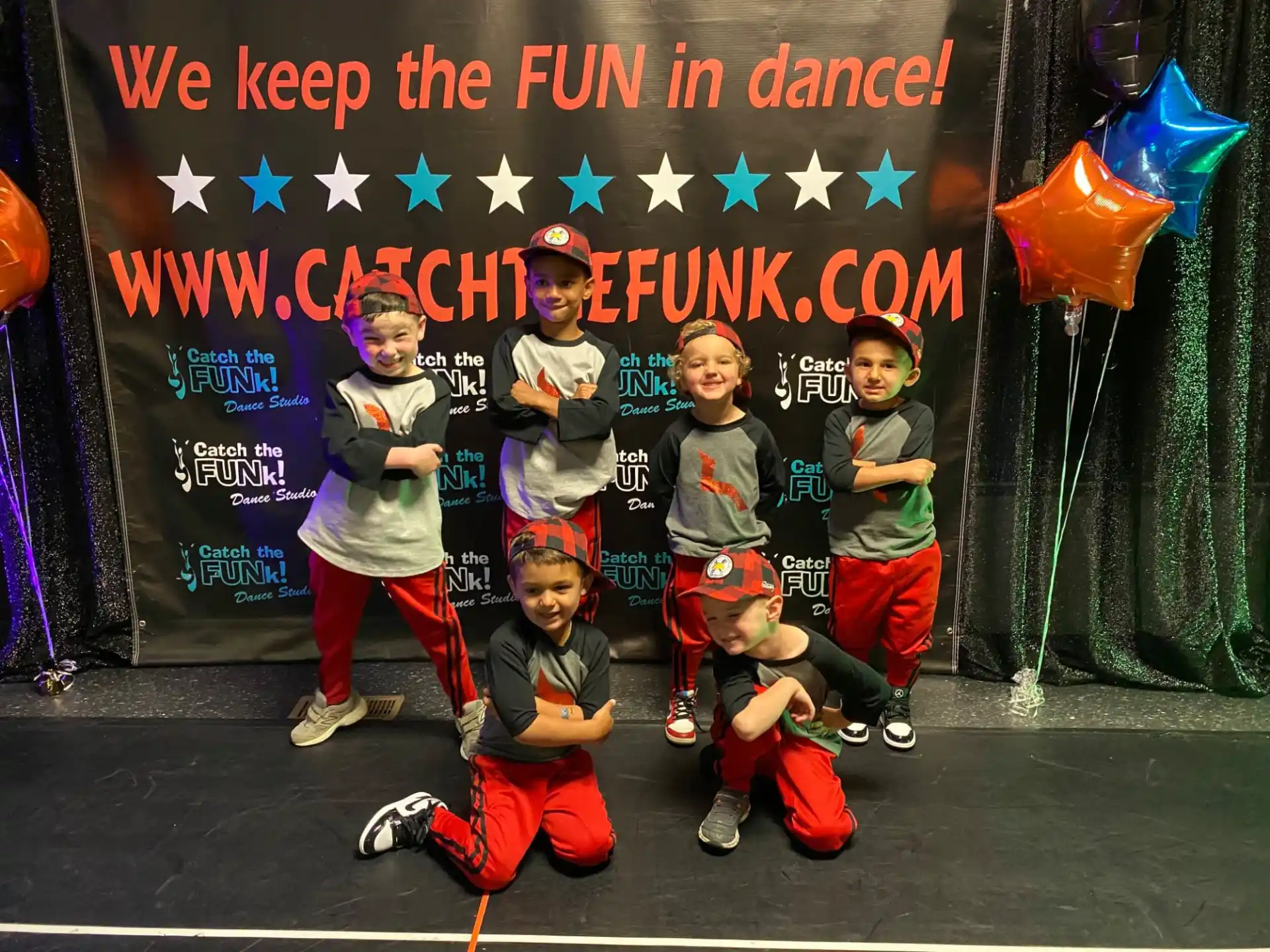 a group of kids posing for a picture
