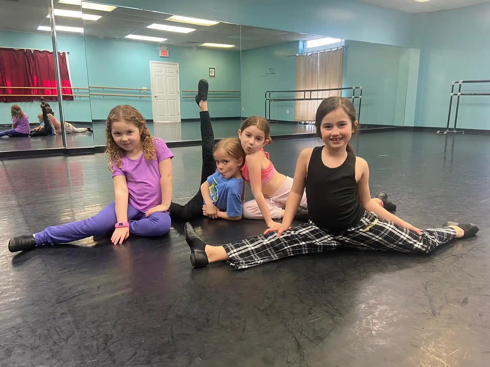 a group of children sitting on the floor
