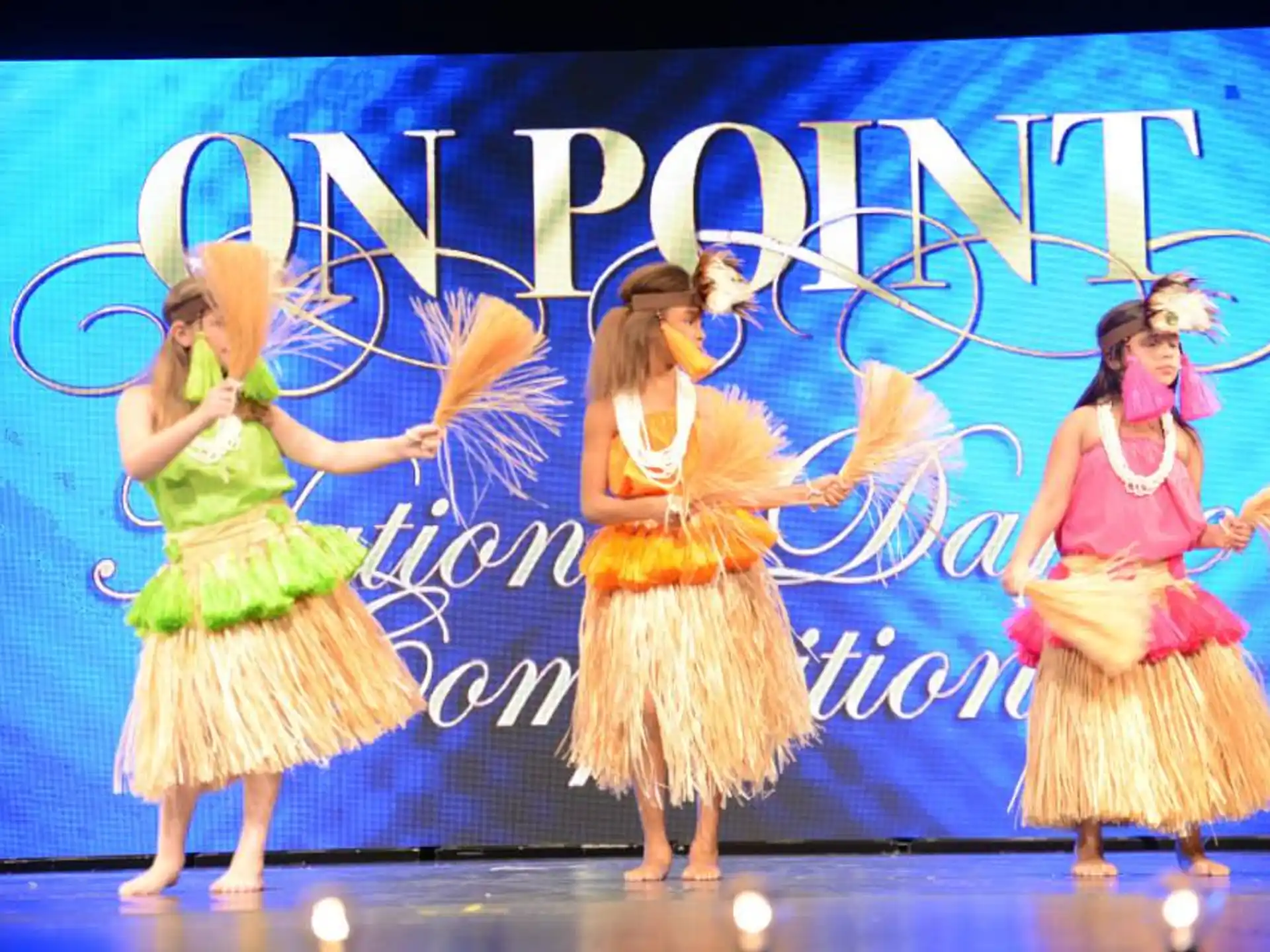 a group of women dancing on a stage
