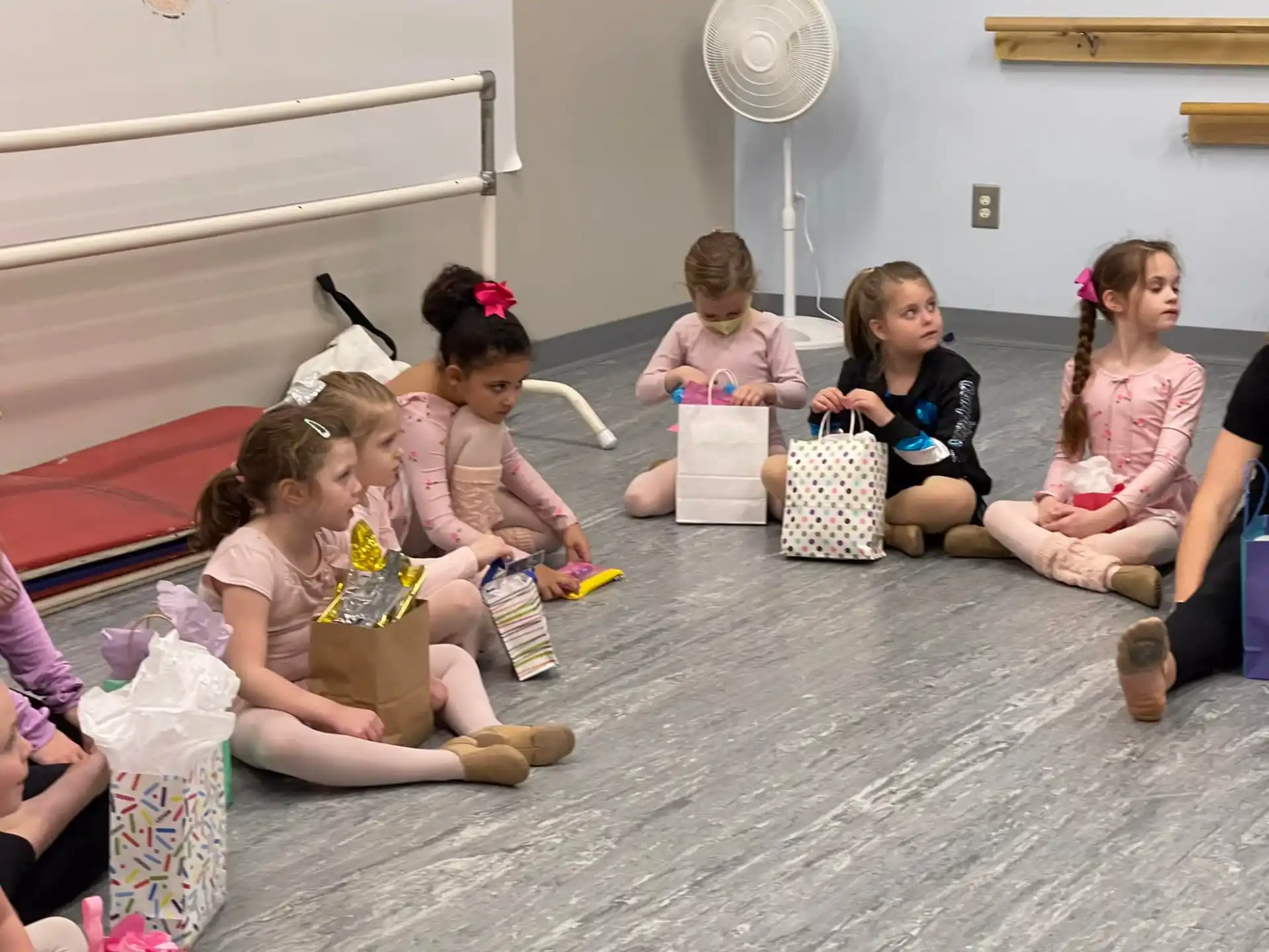 a group of children sitting on the floor