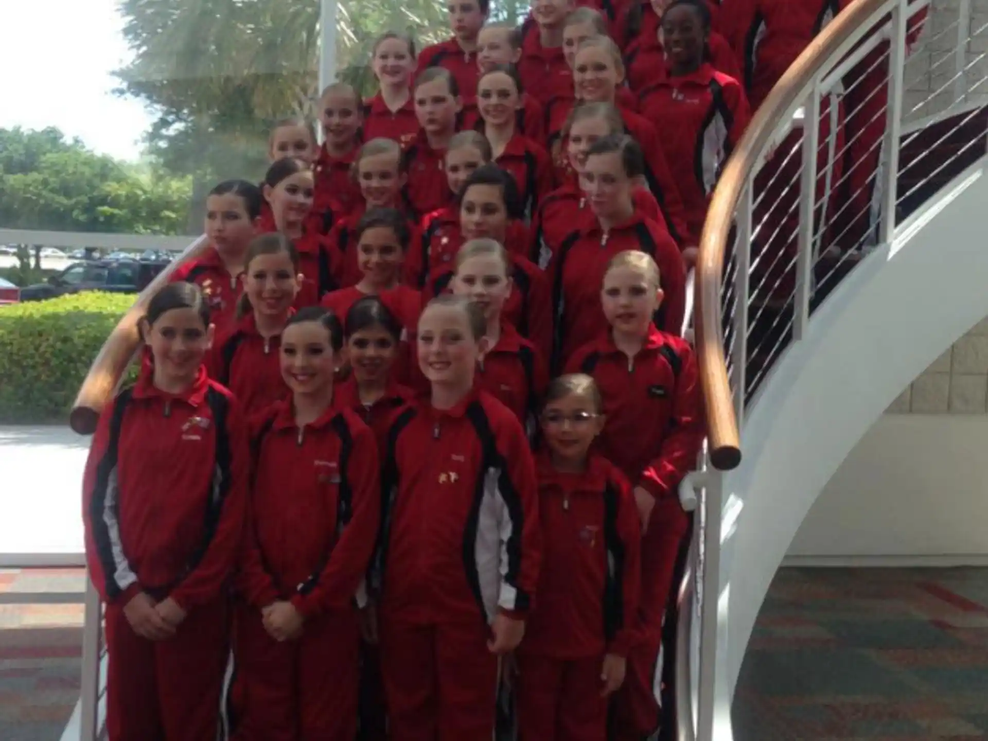 a group of people in red uniforms