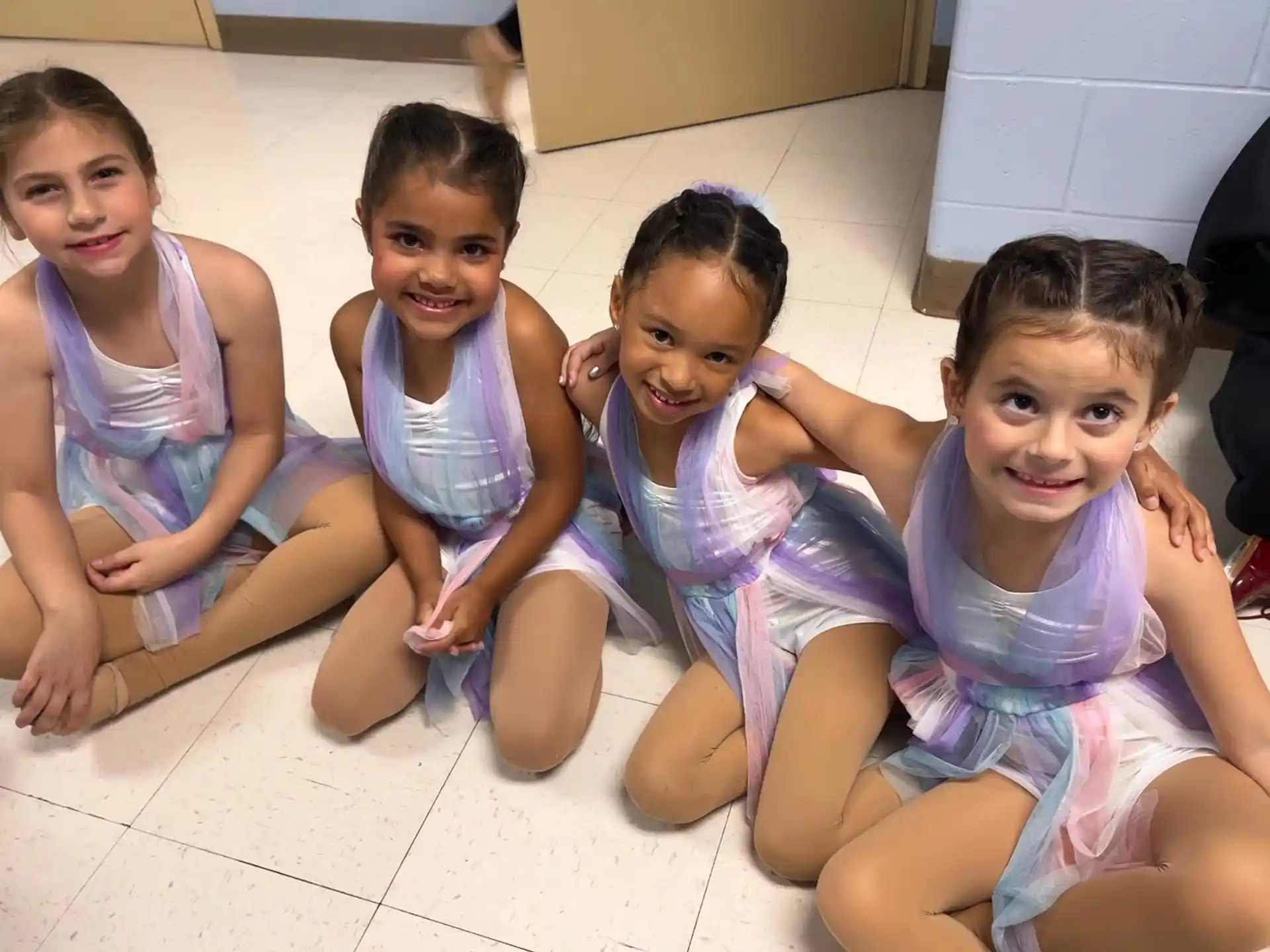 a group of children sitting on the floor