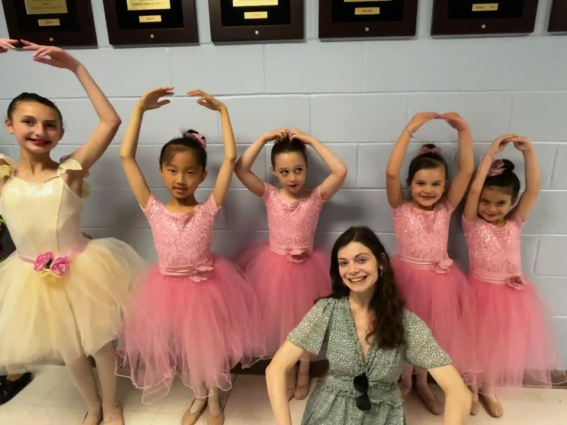 a group of girls in dresses